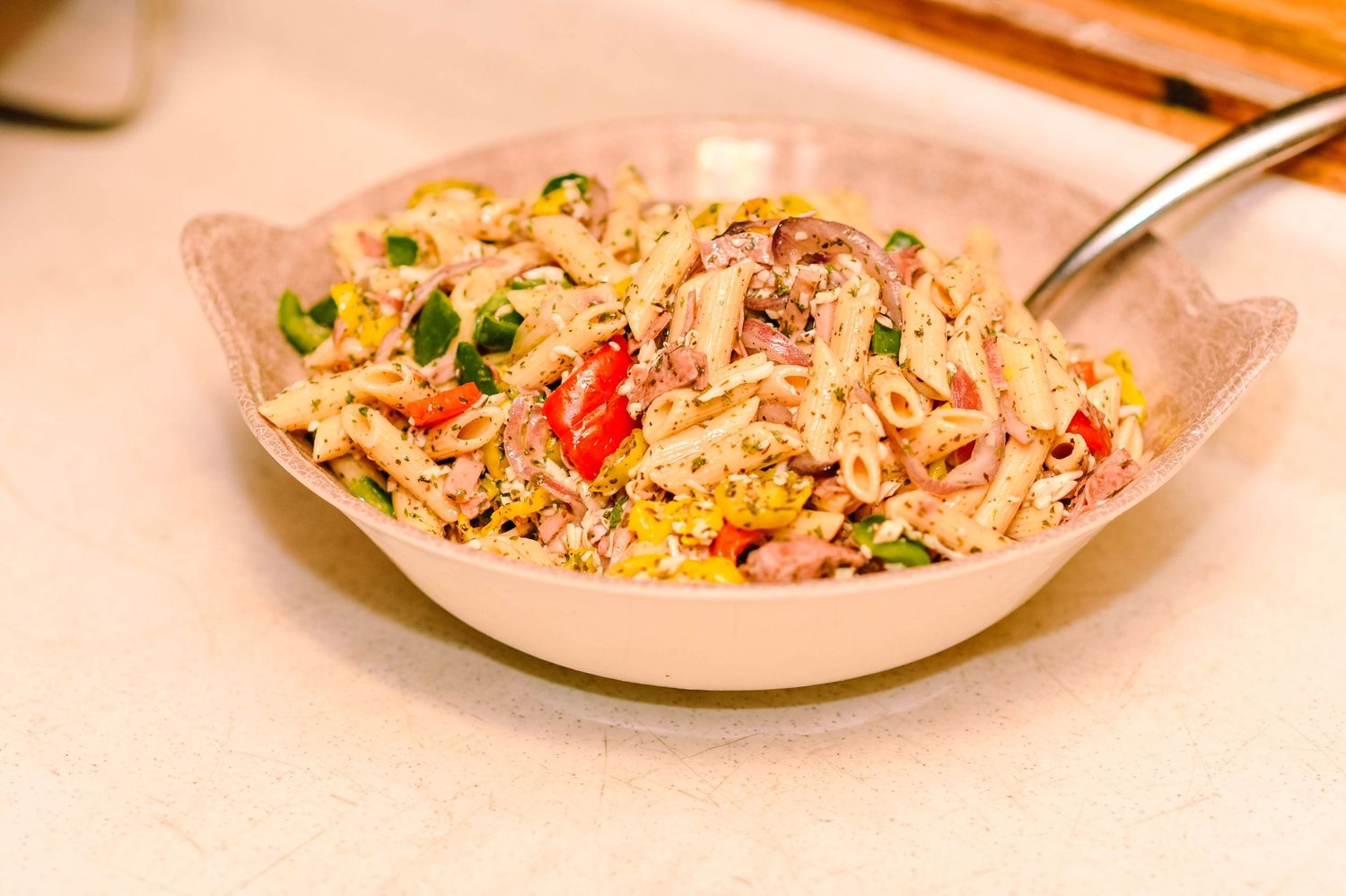 Multiple plates of delicious fried rice with colorful vegetables served on white dishes.