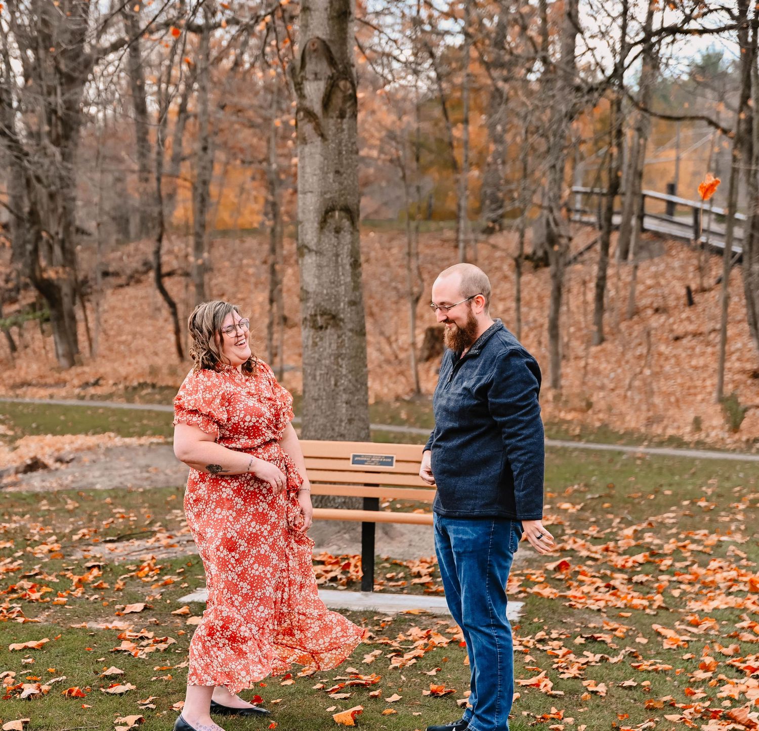 A series of playful moments in an autumn park with fallen leaves and a pink dress.