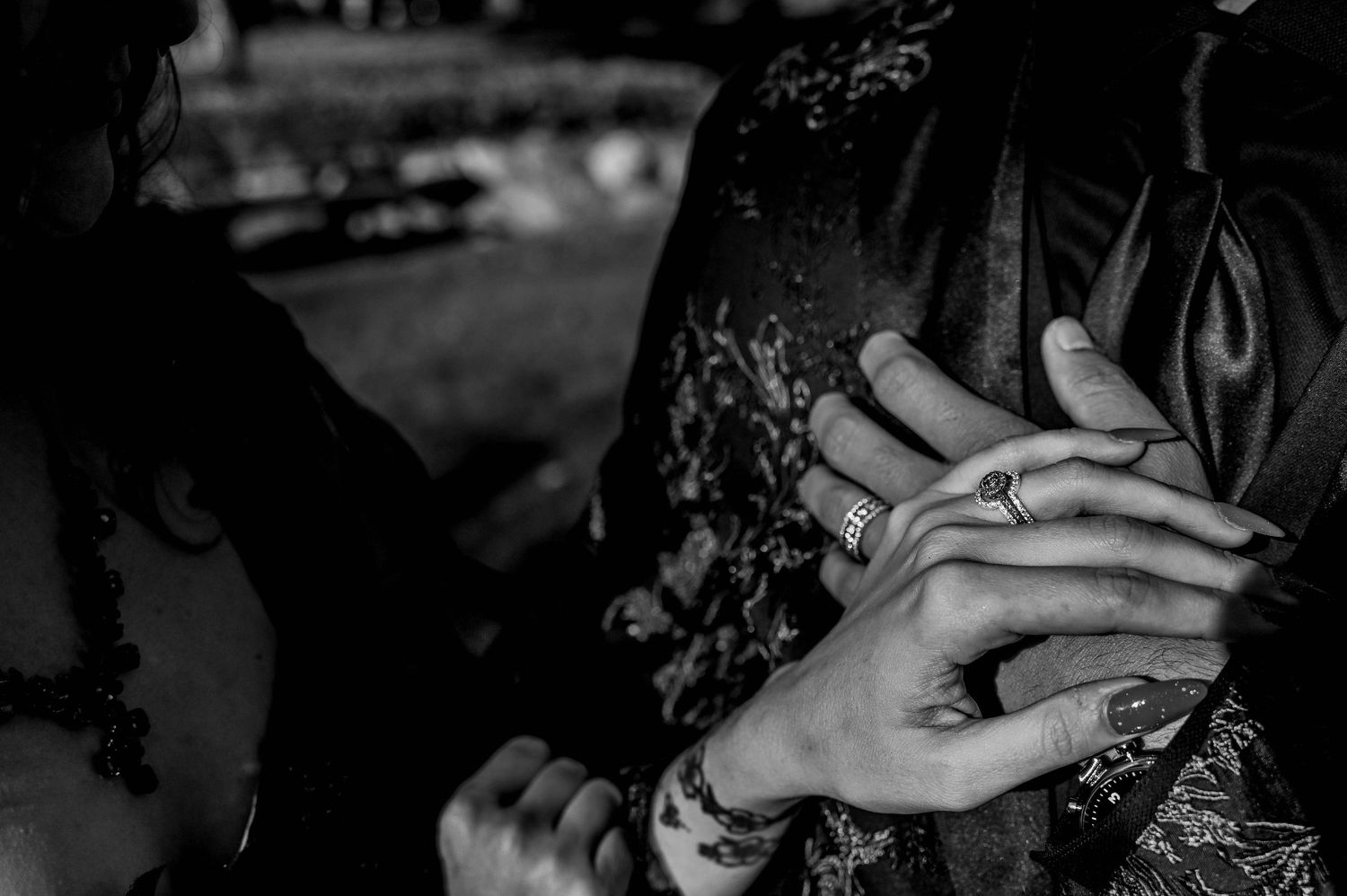 Close-up black and white images showing hands and gestures in sequence.