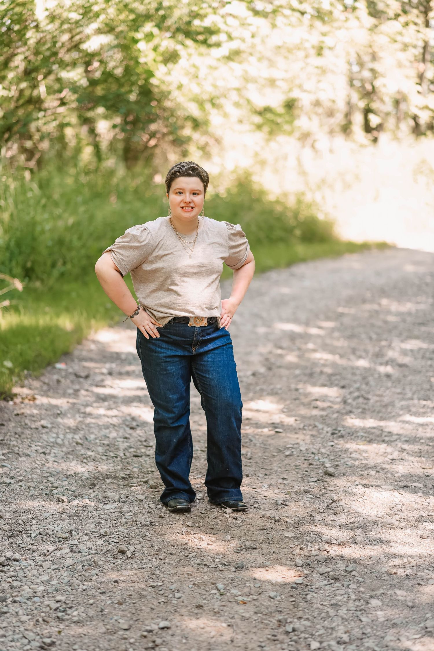 A series of casual outdoor portraits showing someone in jeans and a light colored shirt on a gravel path.