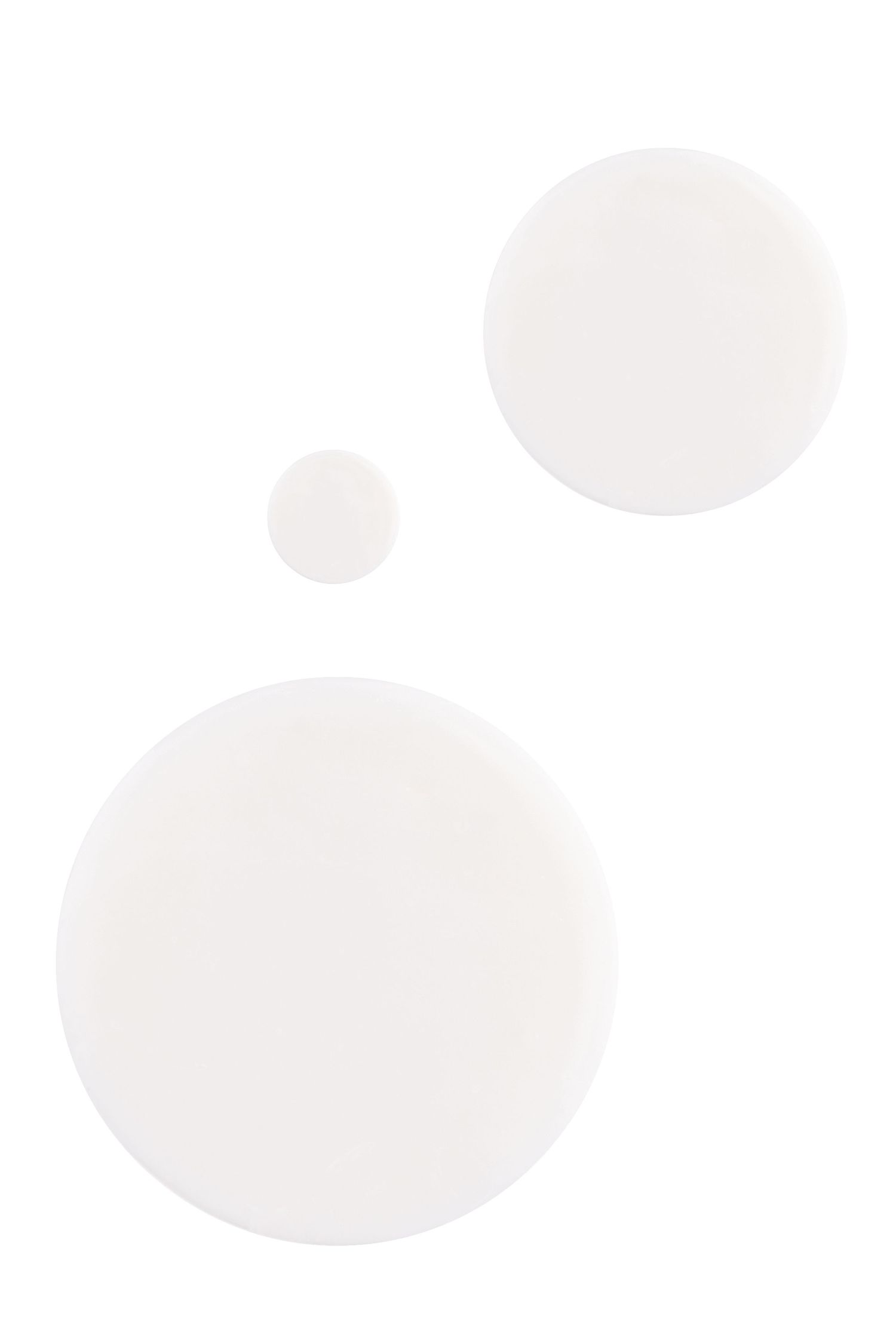 A product shot of dabs of hand cream.