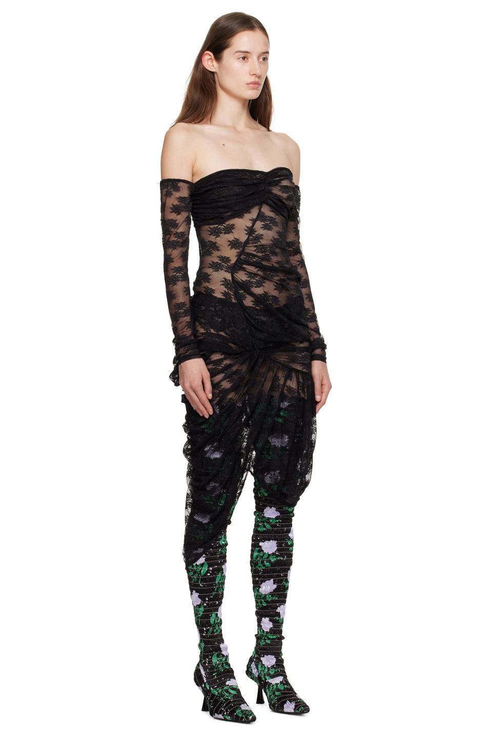 Model Ruby Evers wears a sheer black lace gown by designer Yuhan Wang.