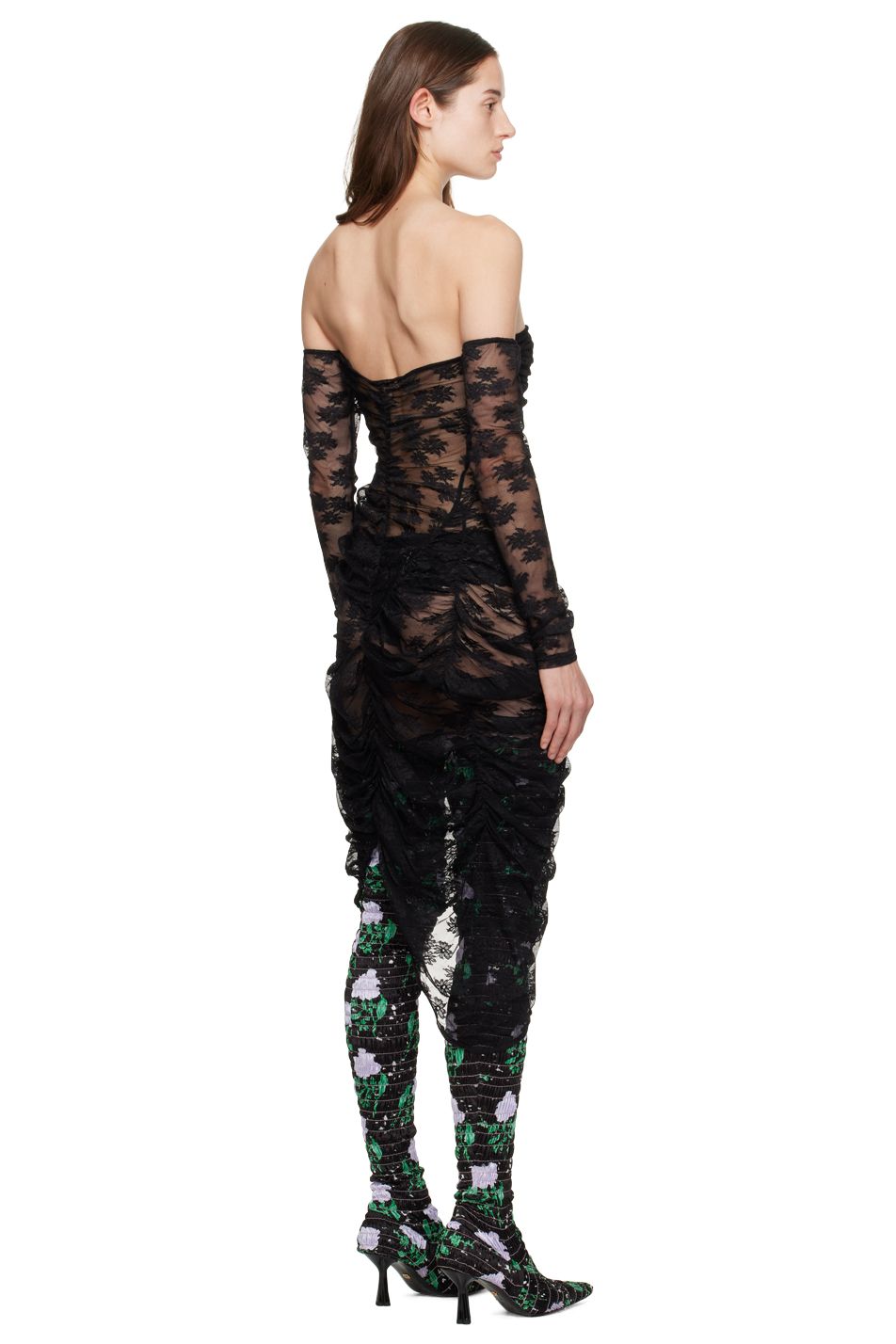 A model wears an off-the-shoulder sheer black lace gown by designer Yuhan Wang.