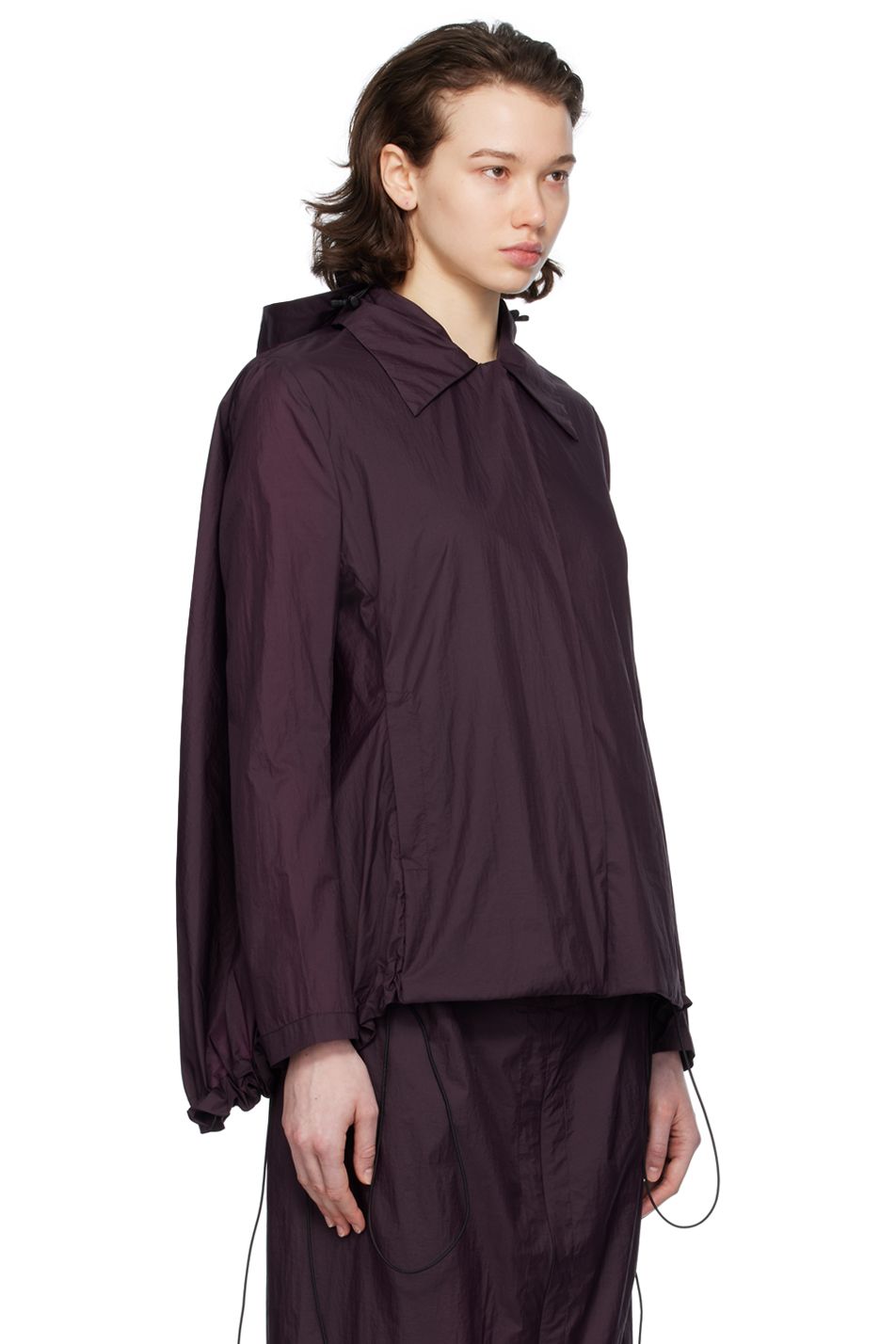 A model wears a purple rain jacket by designer Johanna Parv.