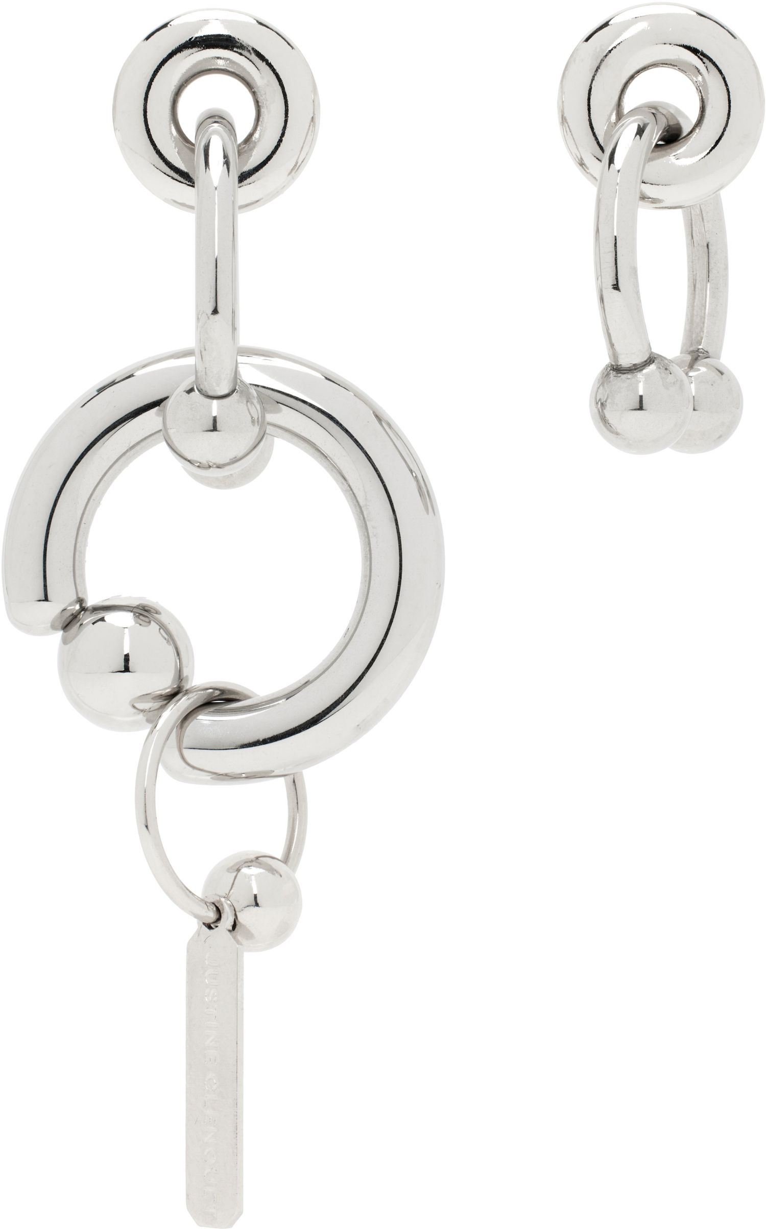 E-commerce product shot of a pair of asymmetrical stainless steel earrings by French jewelry designer Justine Clenquet.