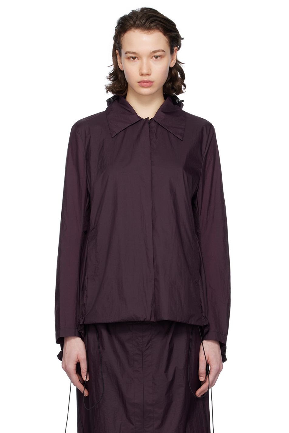A model wears a purple rain jacket by designer Johanna Parv.