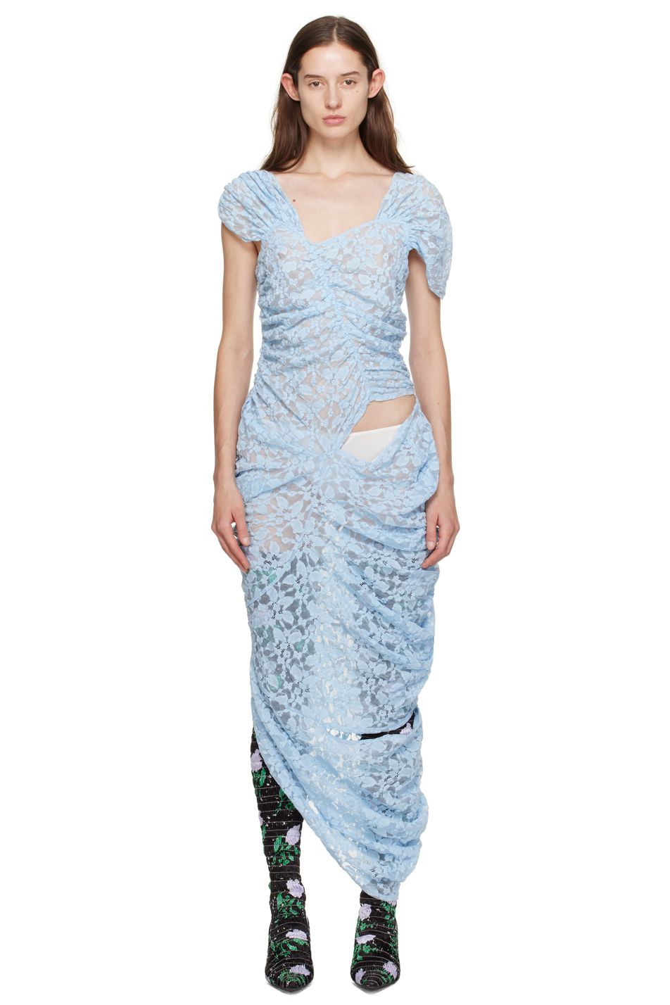 Model Ruby Evers wears a long baby blue sheer lace gown and floral boots by designer Yuhan Wang.
