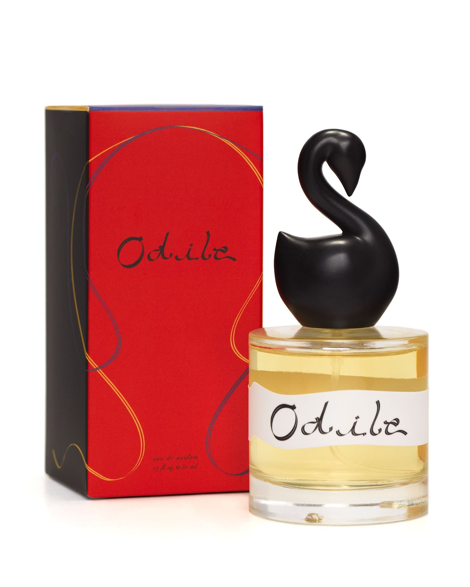 A bottle of Gumamina's Odile perfume photographed with its bright red illustrative box.