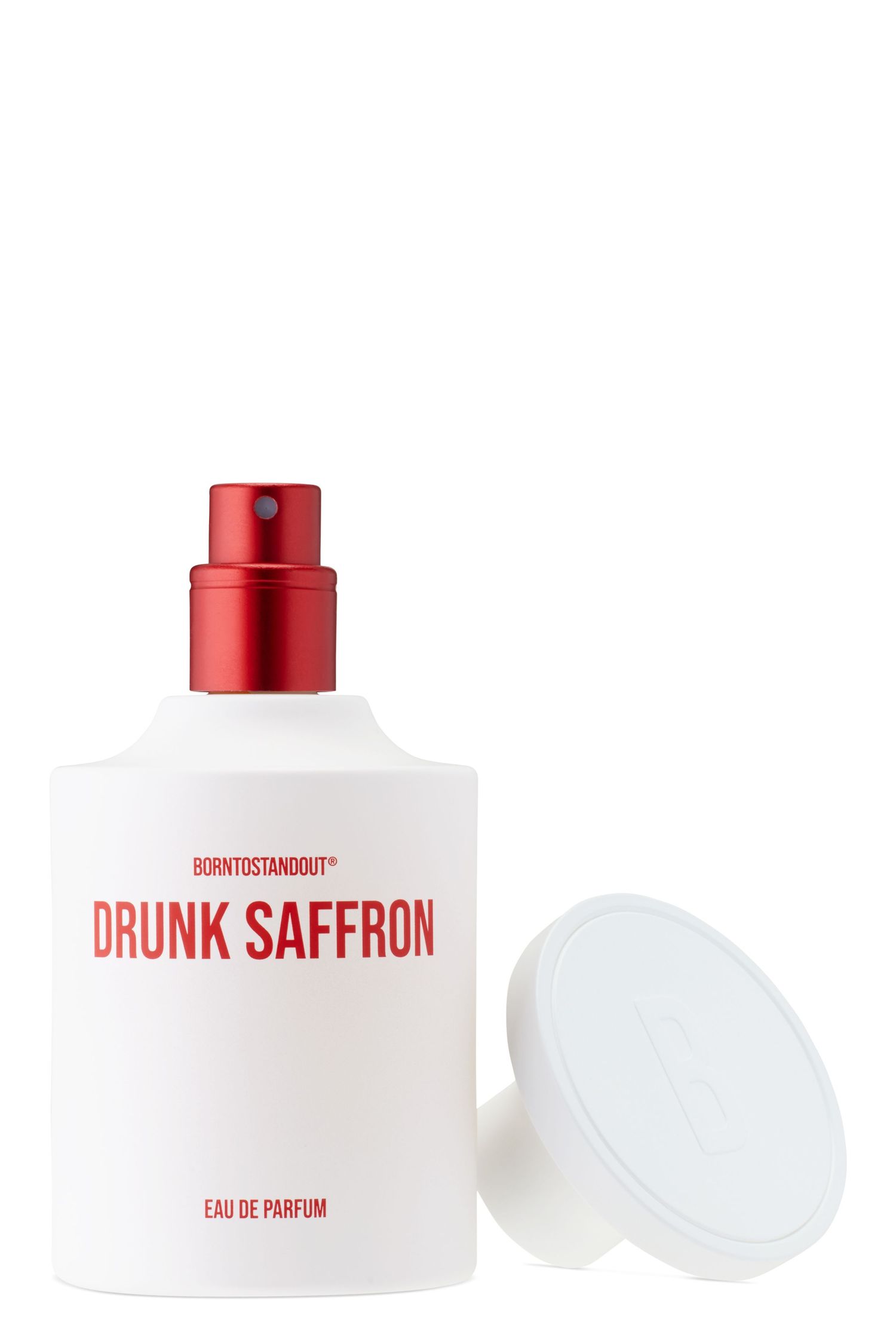 A bottle of BORNTOSTANDOUT Drunk Saffron fragrance with its cap off.