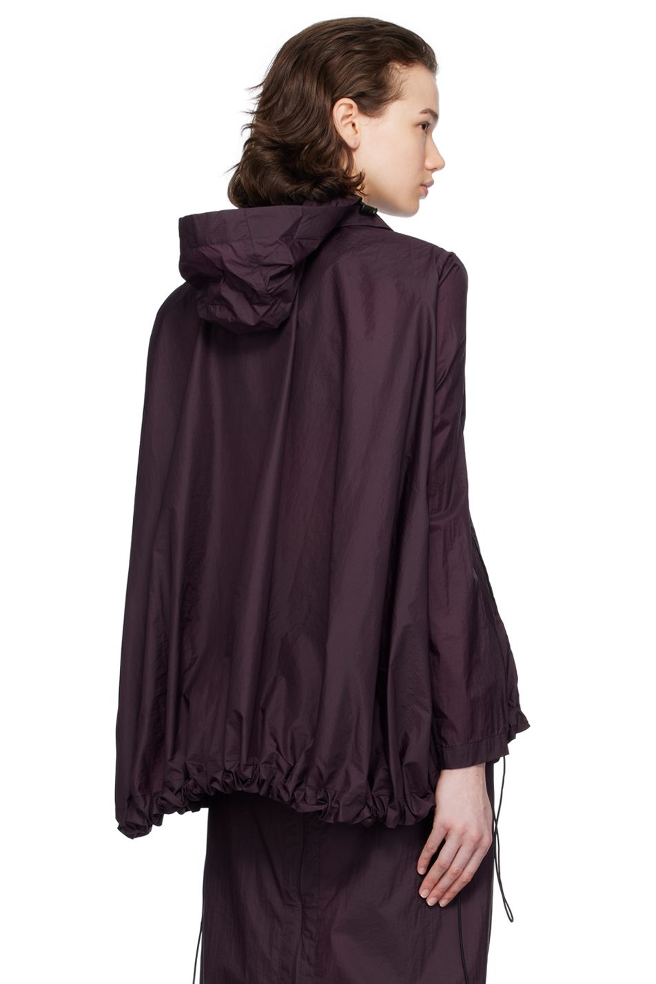 A model wears a hooded purple rain jacket by designer Johanna Parv.