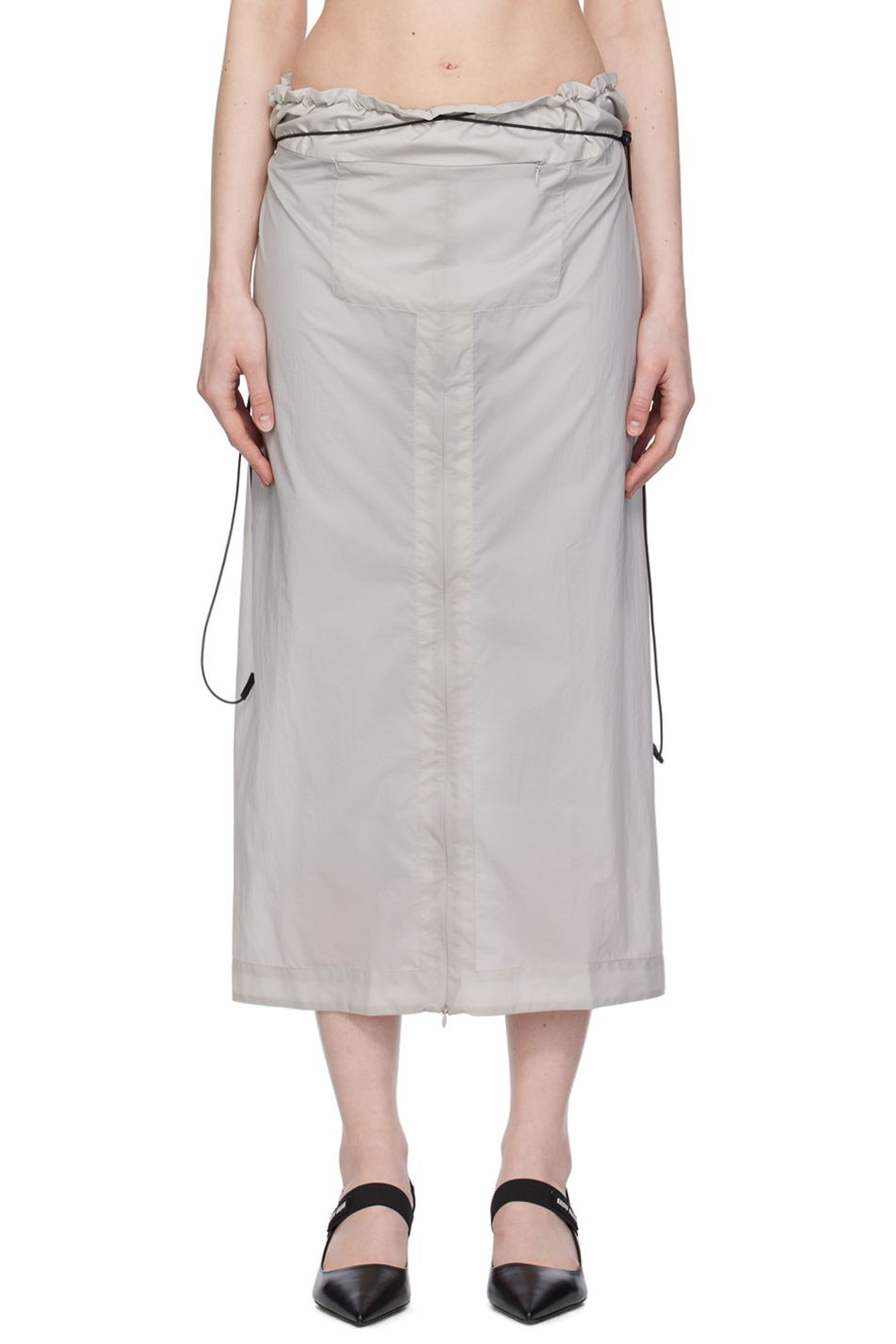 The front view of a grey nylon skirt by Johanna Parv on model.