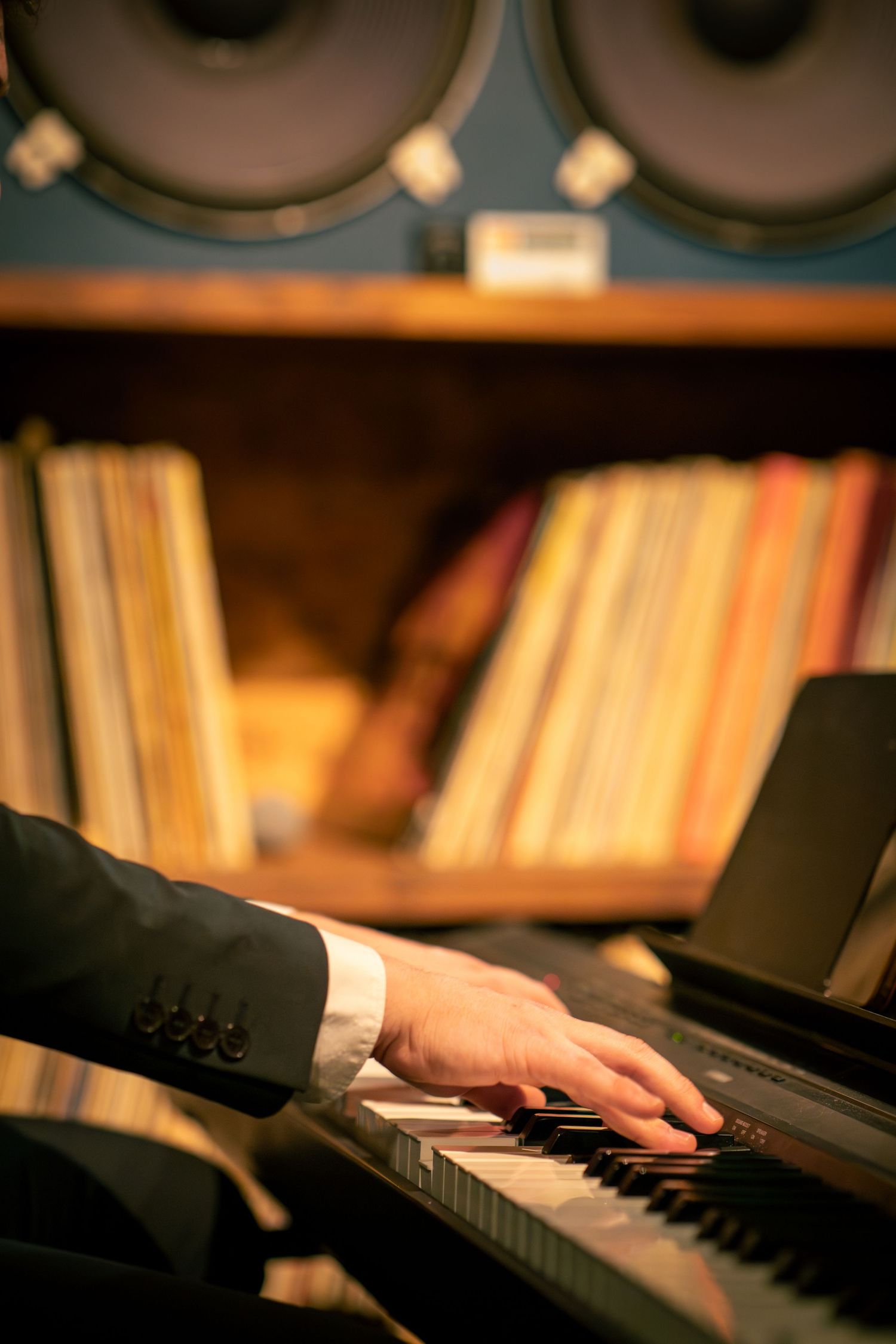 Musician's hands in a jazz club by Eva Z