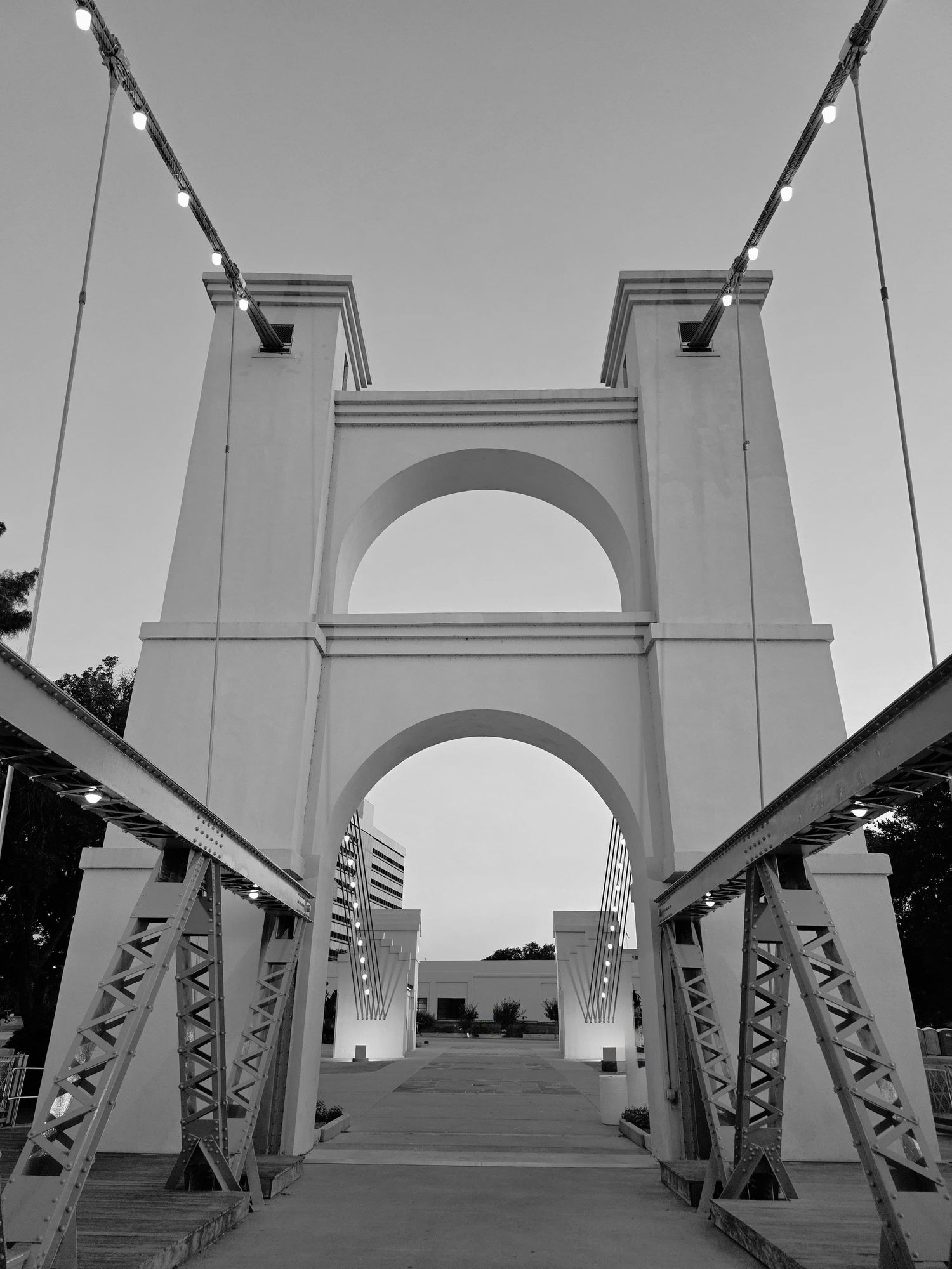 Black and white photograph of the Waco Suspension Bridge in Waco, Texas