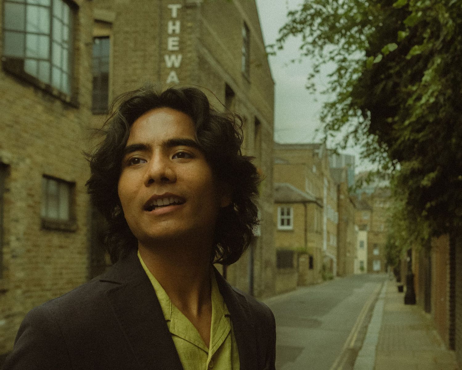 Cinematic street portrait of a man in an urban setting