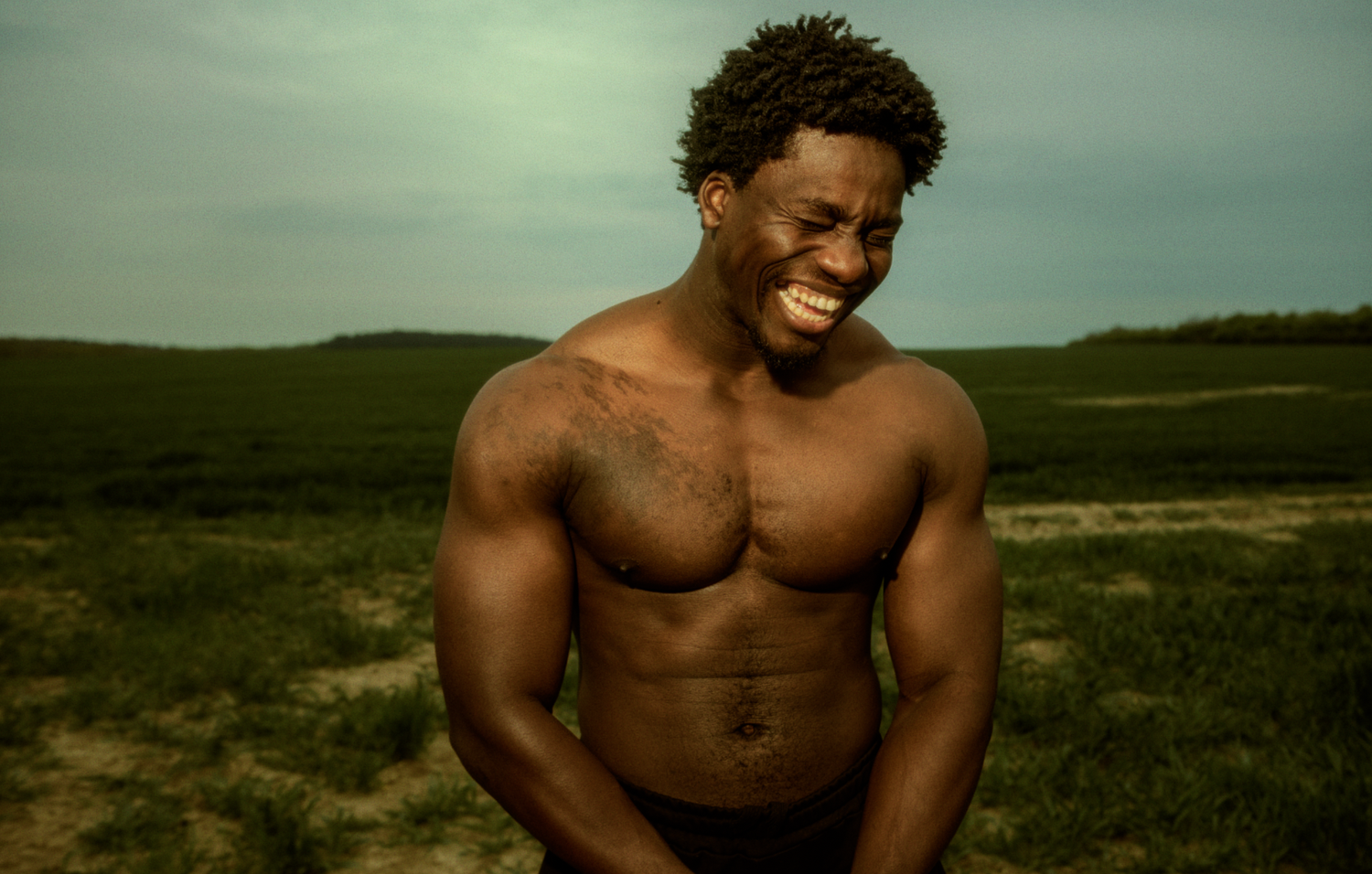 Outdoor portrait of a smiling man photographed in a cinematic style