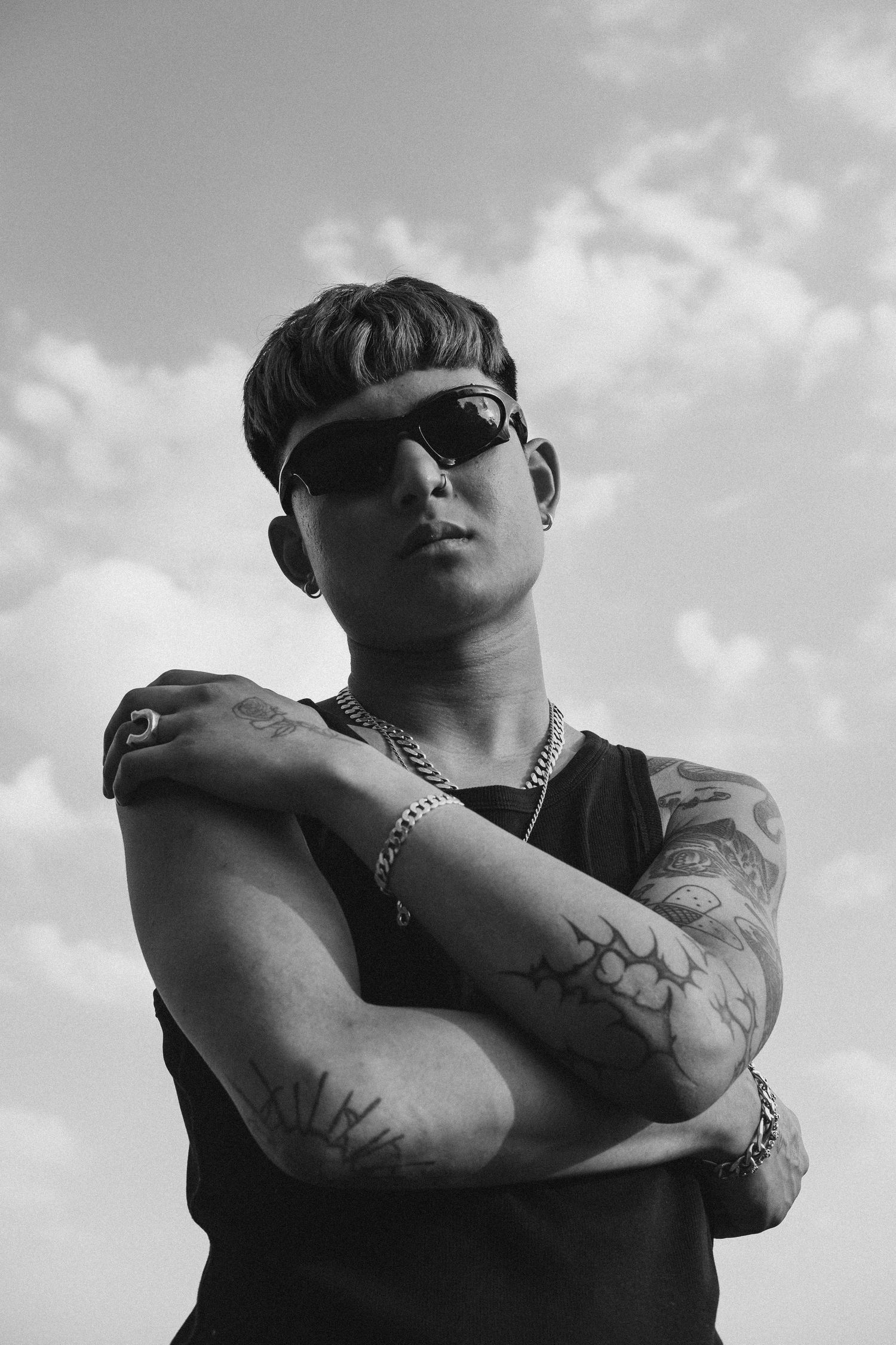 Black and white portrait of a young man photographed outdoors