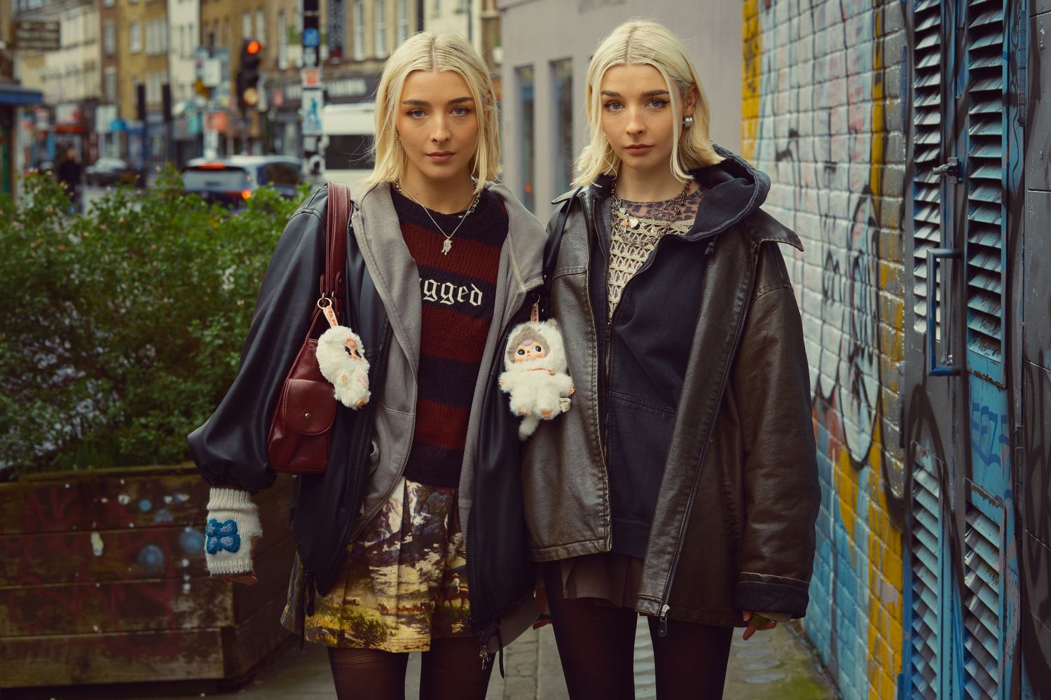 Portrait of Twins standing together on a colourful London street