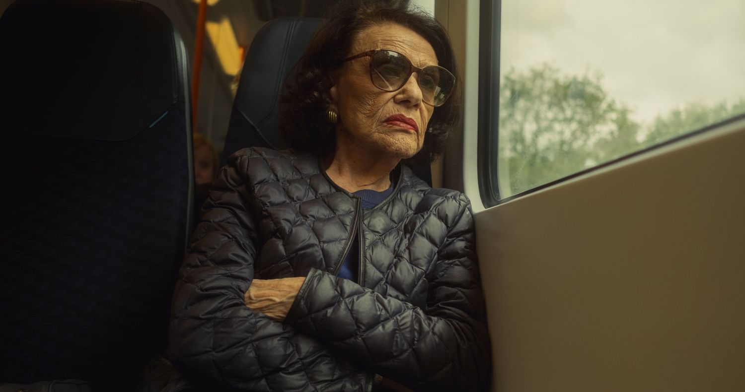 Editorial portrait of a woman travelling on a South Western Railway train