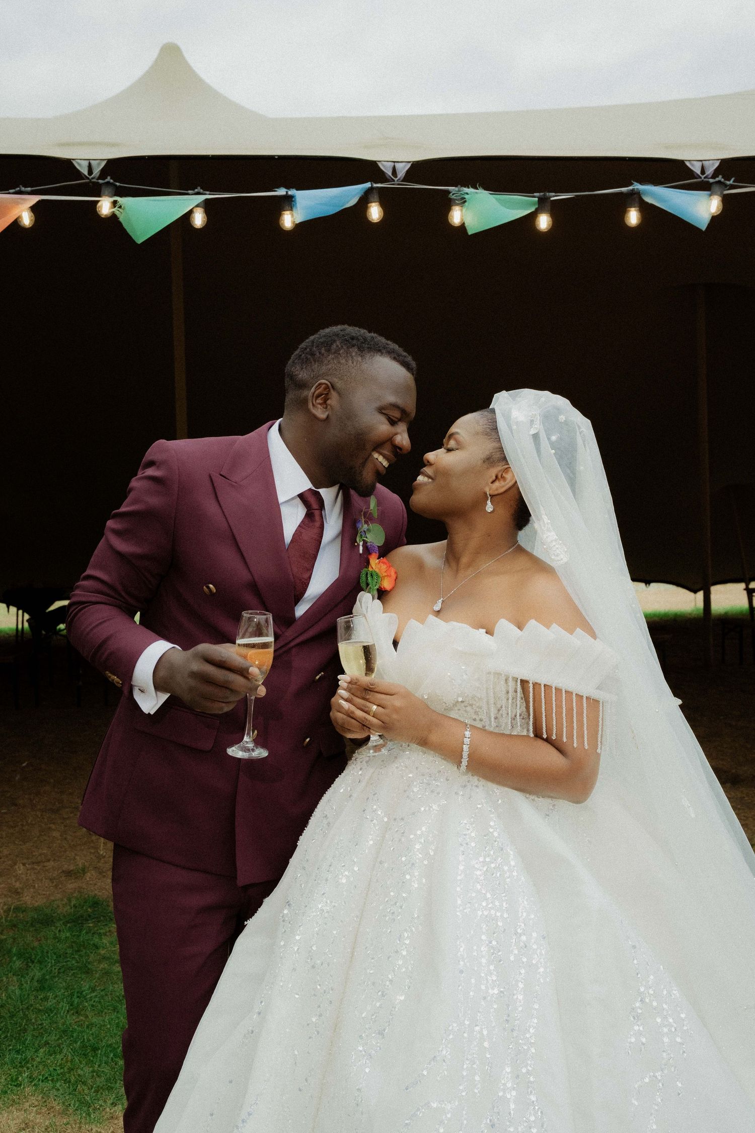 Wedding couple dancing together outdoors at a reception, captured in a cinematic wedding photography style