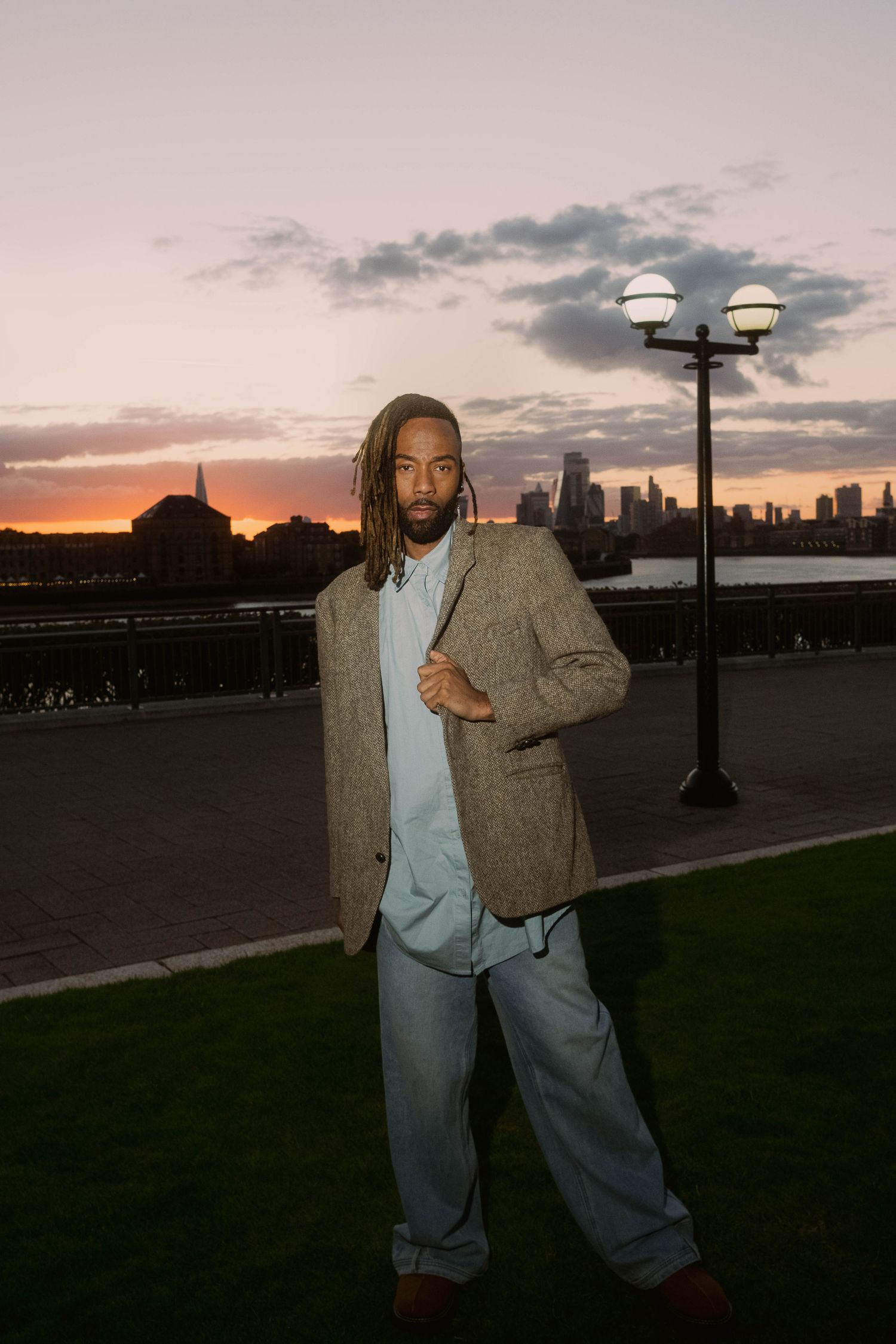 Environmental portrait of a man photographed outdoors during sunset