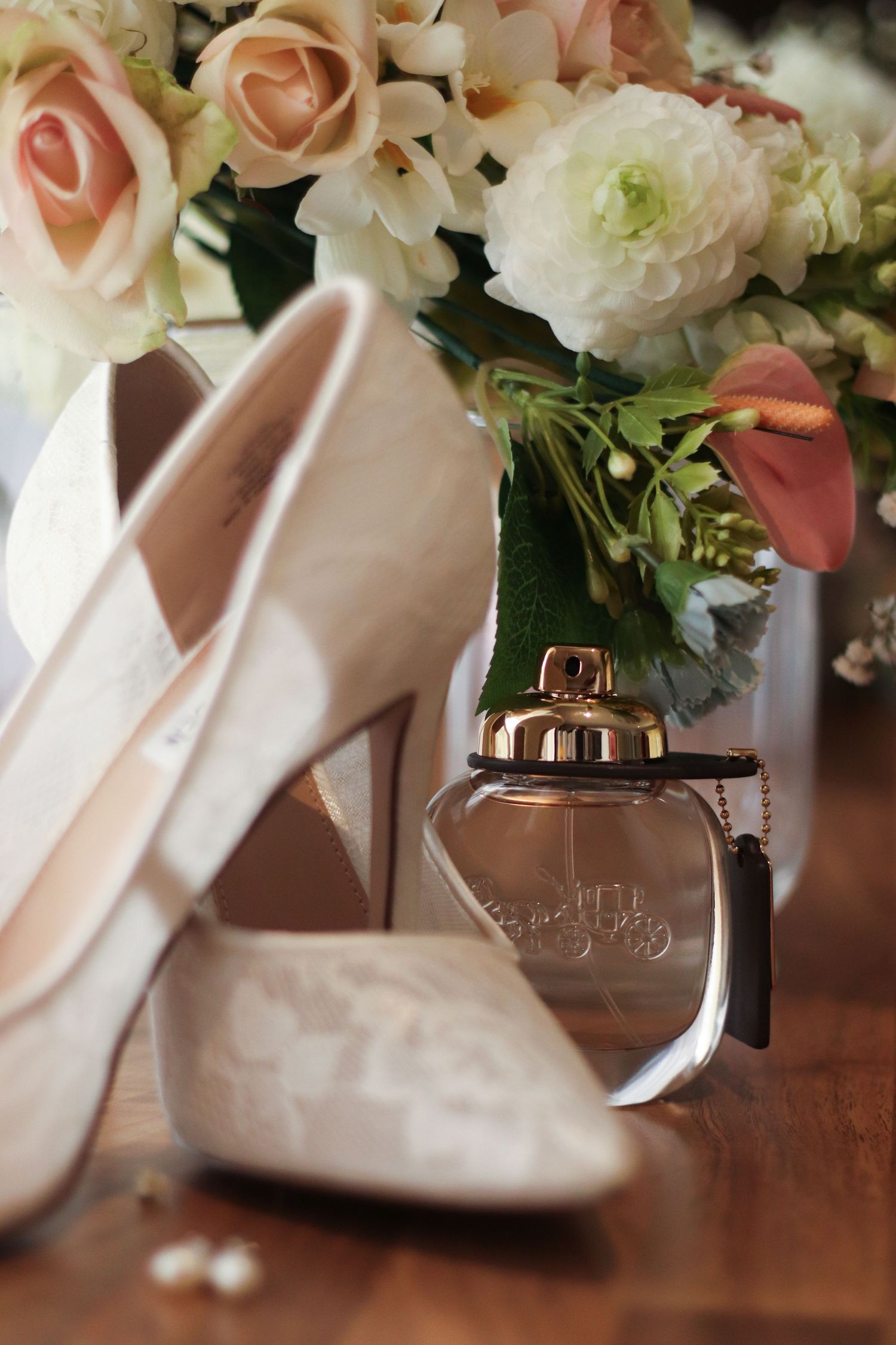 Detail image of a brides shoes and other accessories