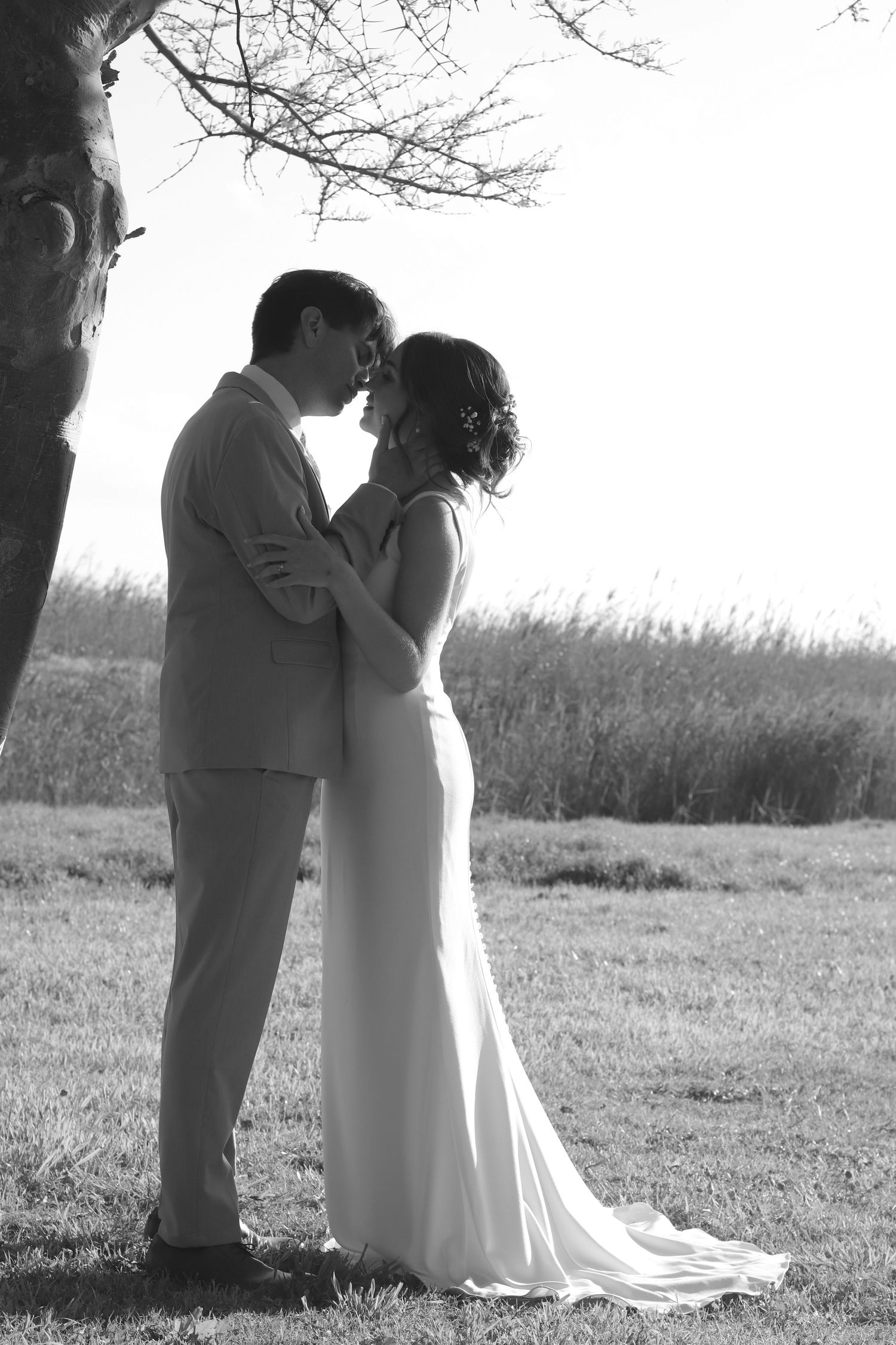 Black and white image of a couple nearly kissing