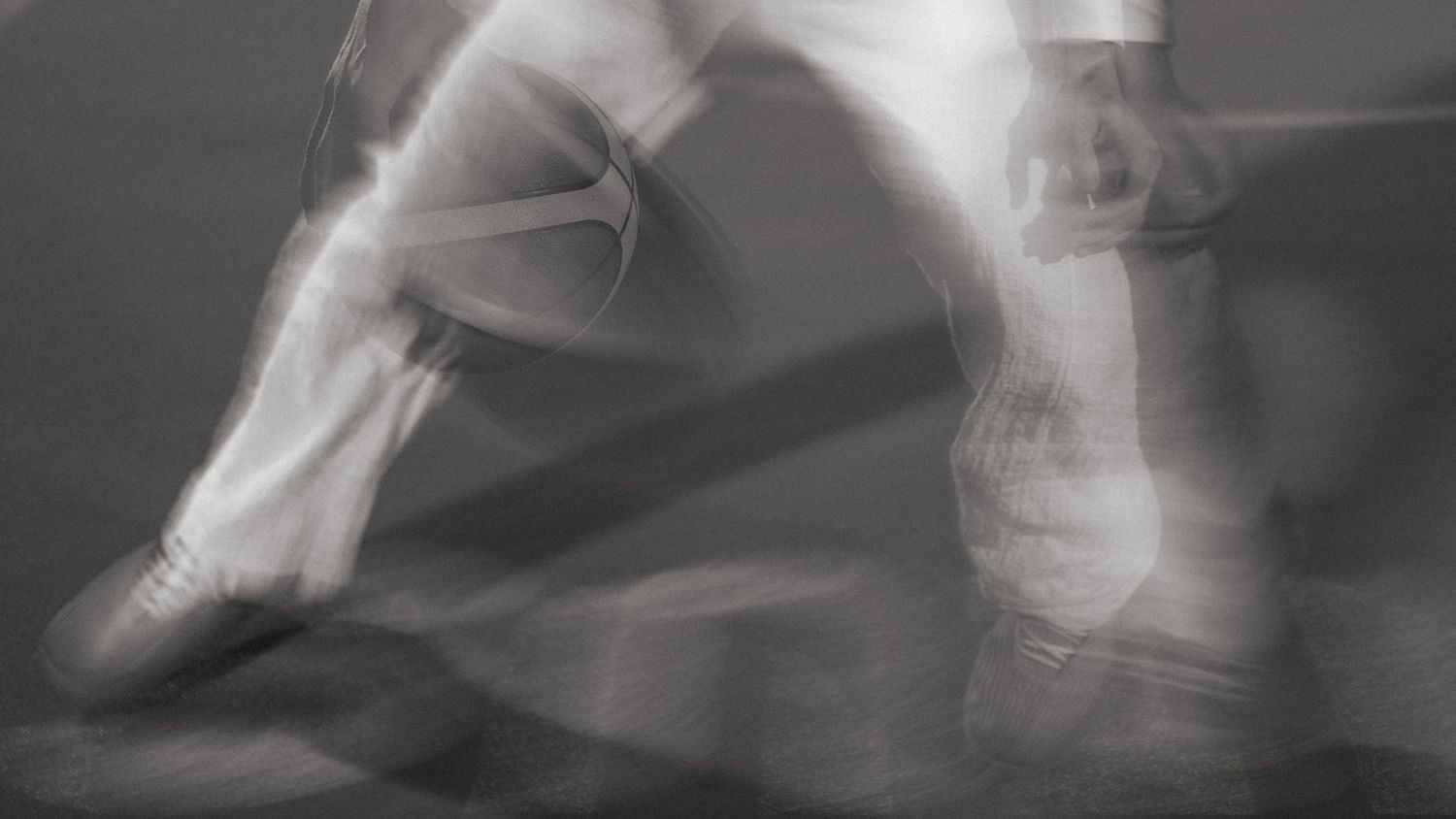 Blurred motion shot of basketball player dribbling, dynamic action photography