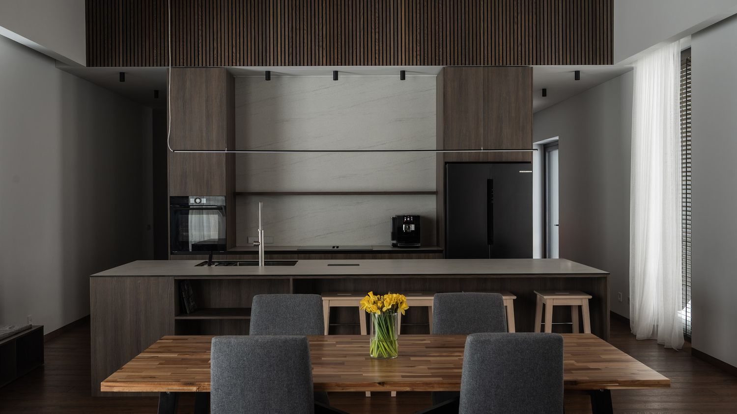 Contemporary dining area with dark wood ceiling