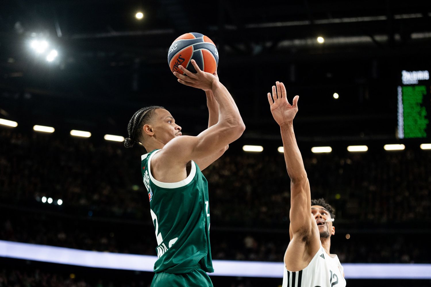Žalgiris player shooting over a defender