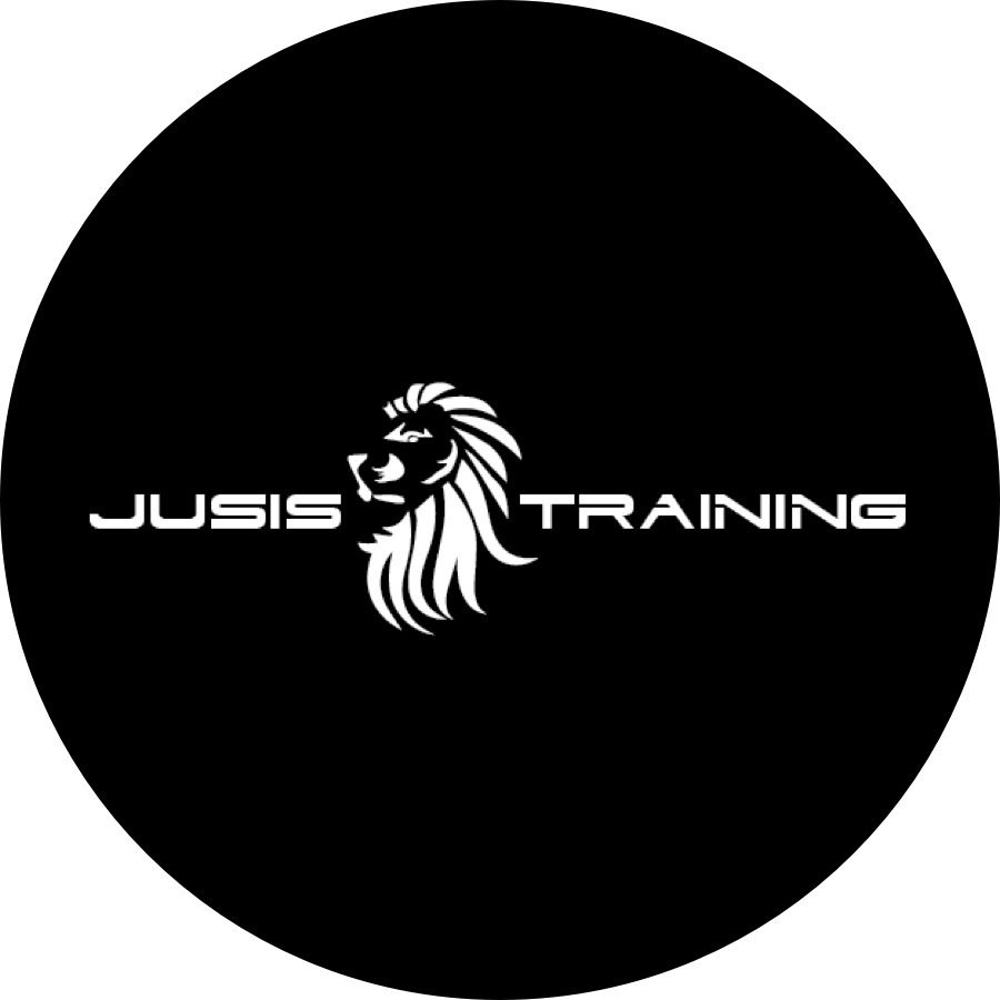 Circular black Jusis Training logo showing a white lion head and white lettering for a fitness and coaching brand.
