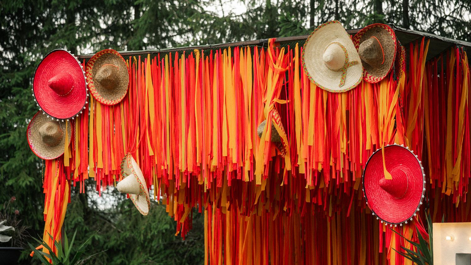 Colorful Mexican-themed backdrop at the corporate summer event