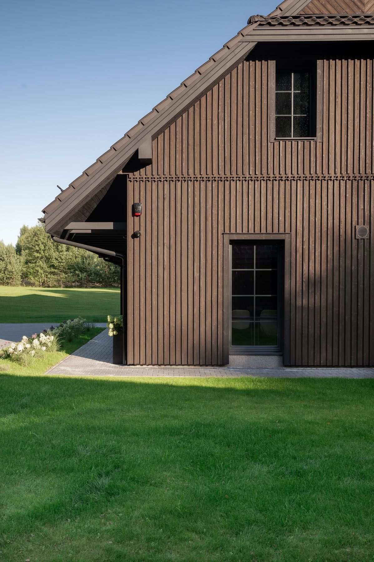 Side view of a contemporary house with a charred timber facade