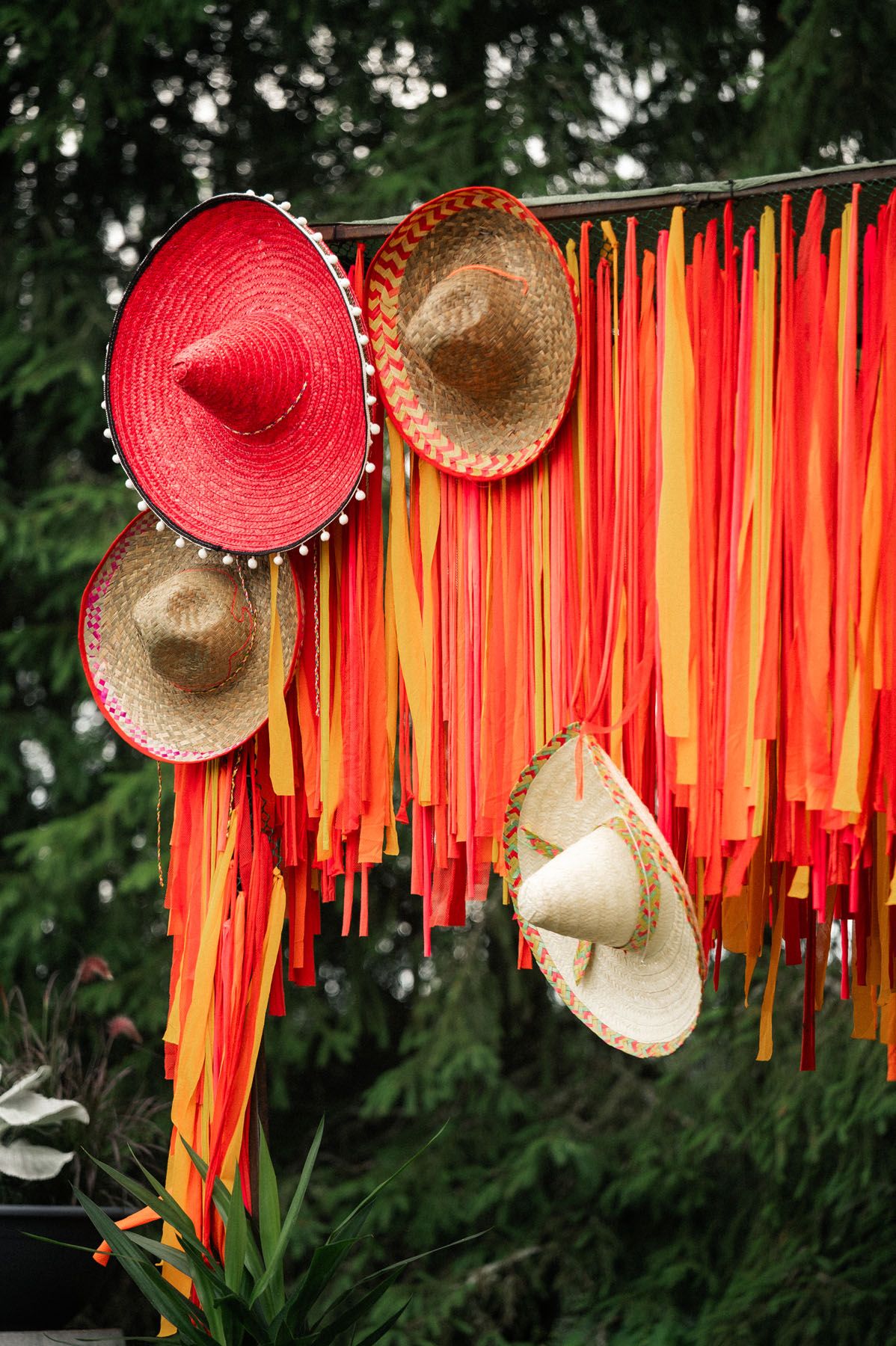 Colorful Mexican-themed event backdrop with sombreros