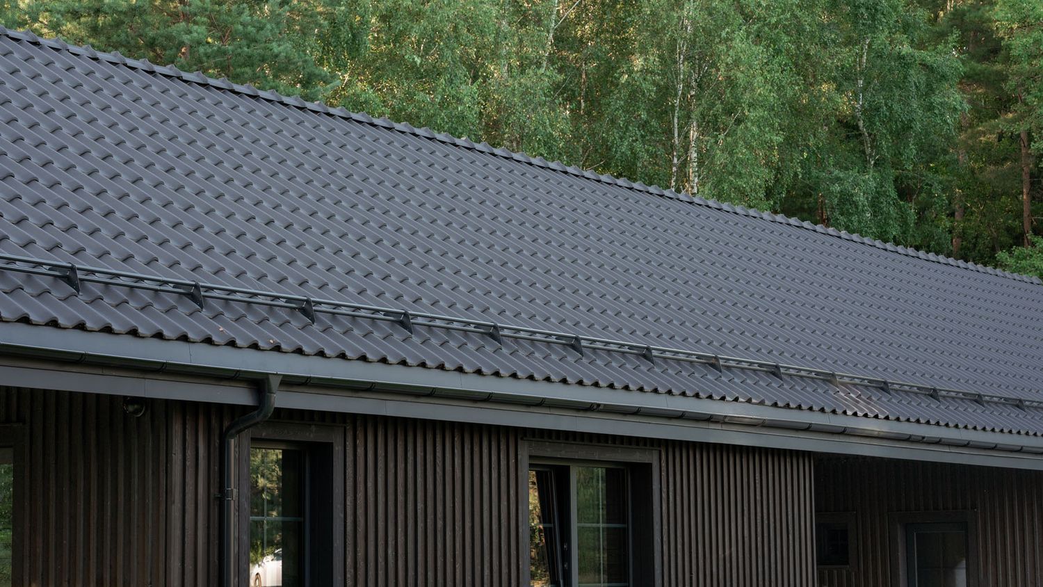 Architectural detail of the roof and charred timber facade