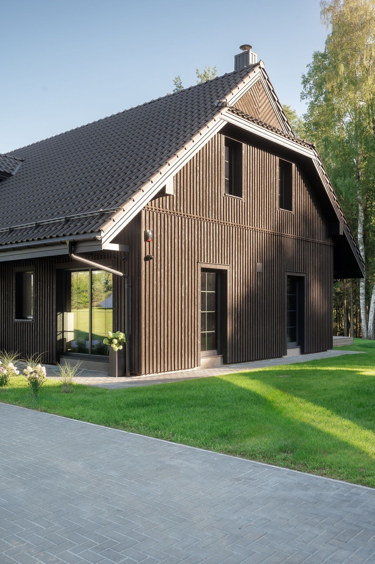 Modern house entrance with Sugi Ban wood cladding in Trakai District