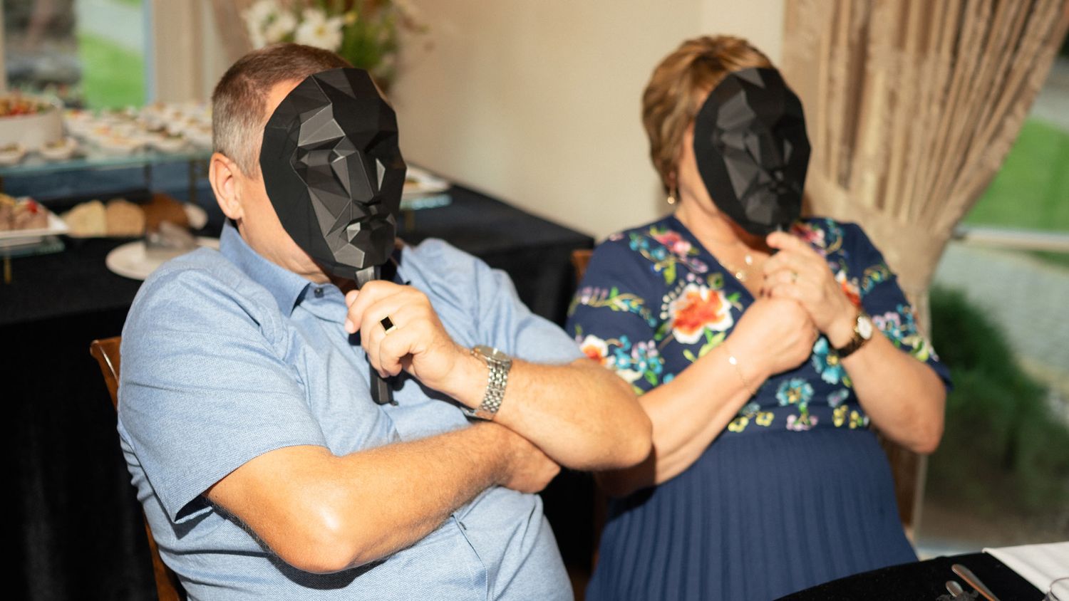 Guests discussing the Mafia game during the private celebration