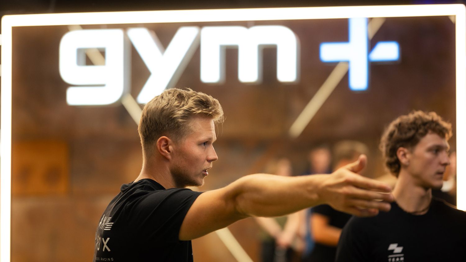 Fitness event participants gathered on the Gym+ training floor
