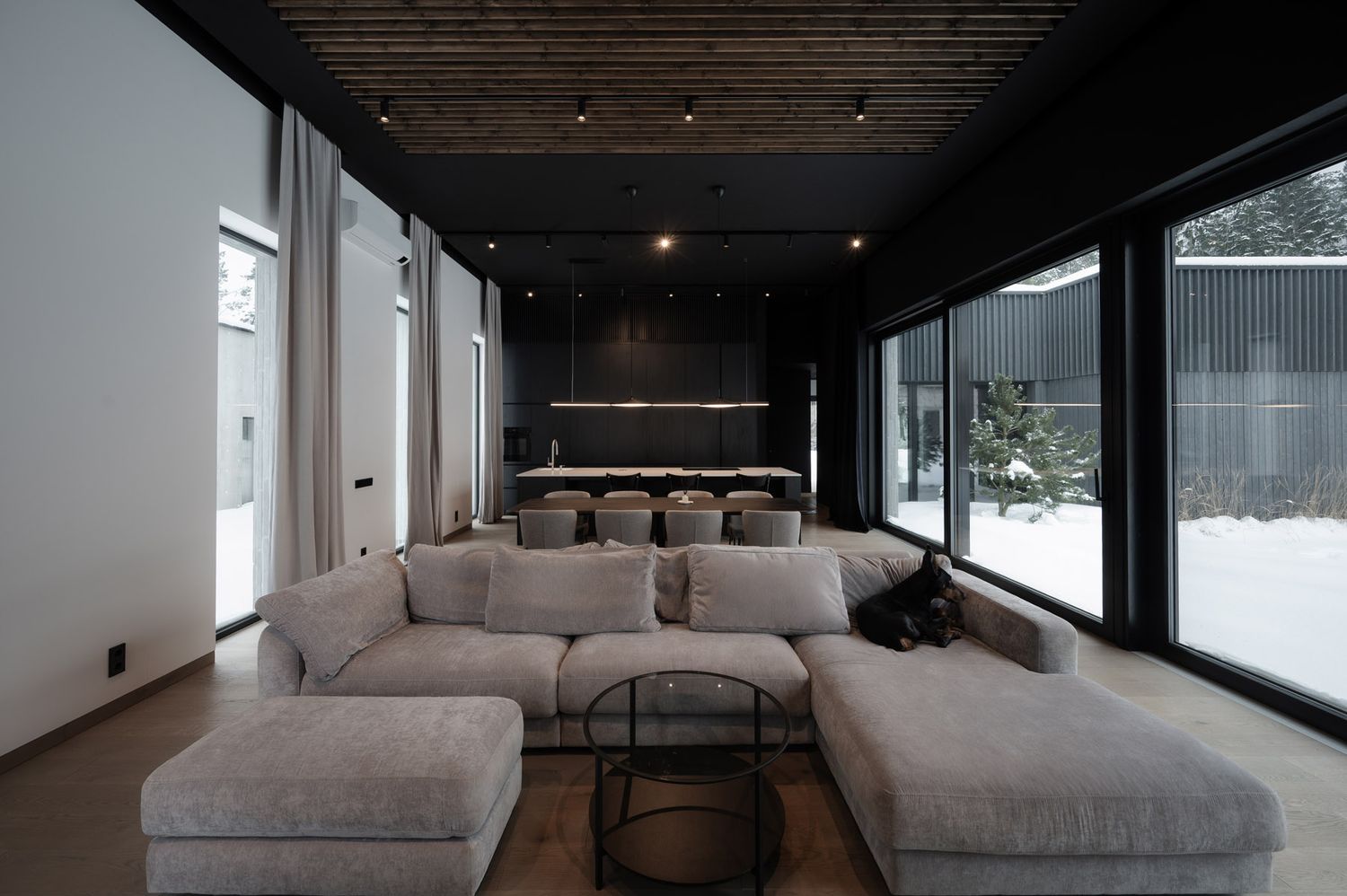 Floor-to-ceiling windows connecting a modern interior with nature