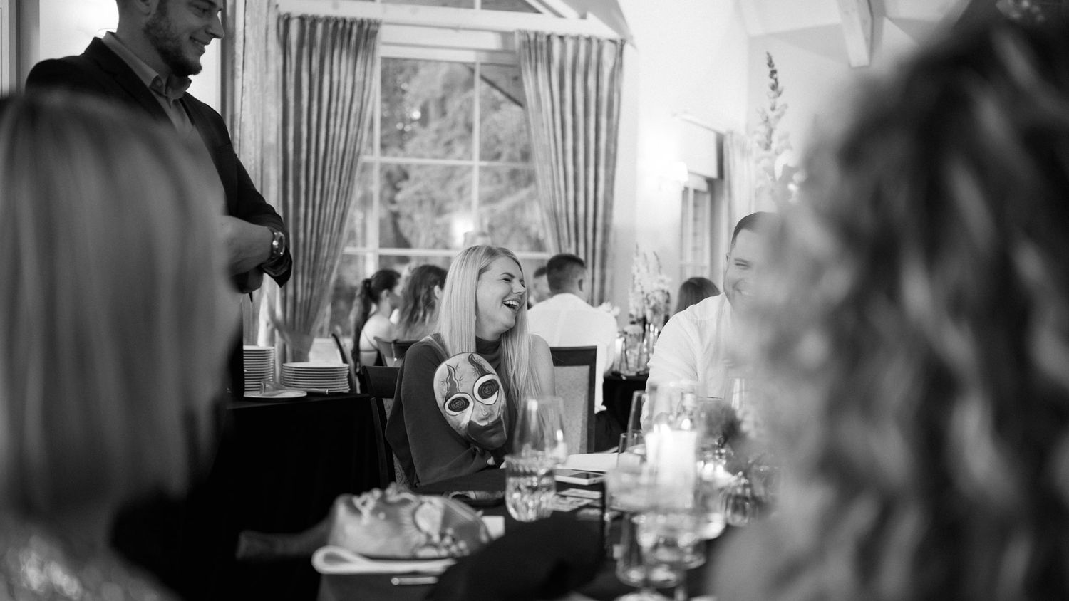 Guests playing Mafia around the dinner table