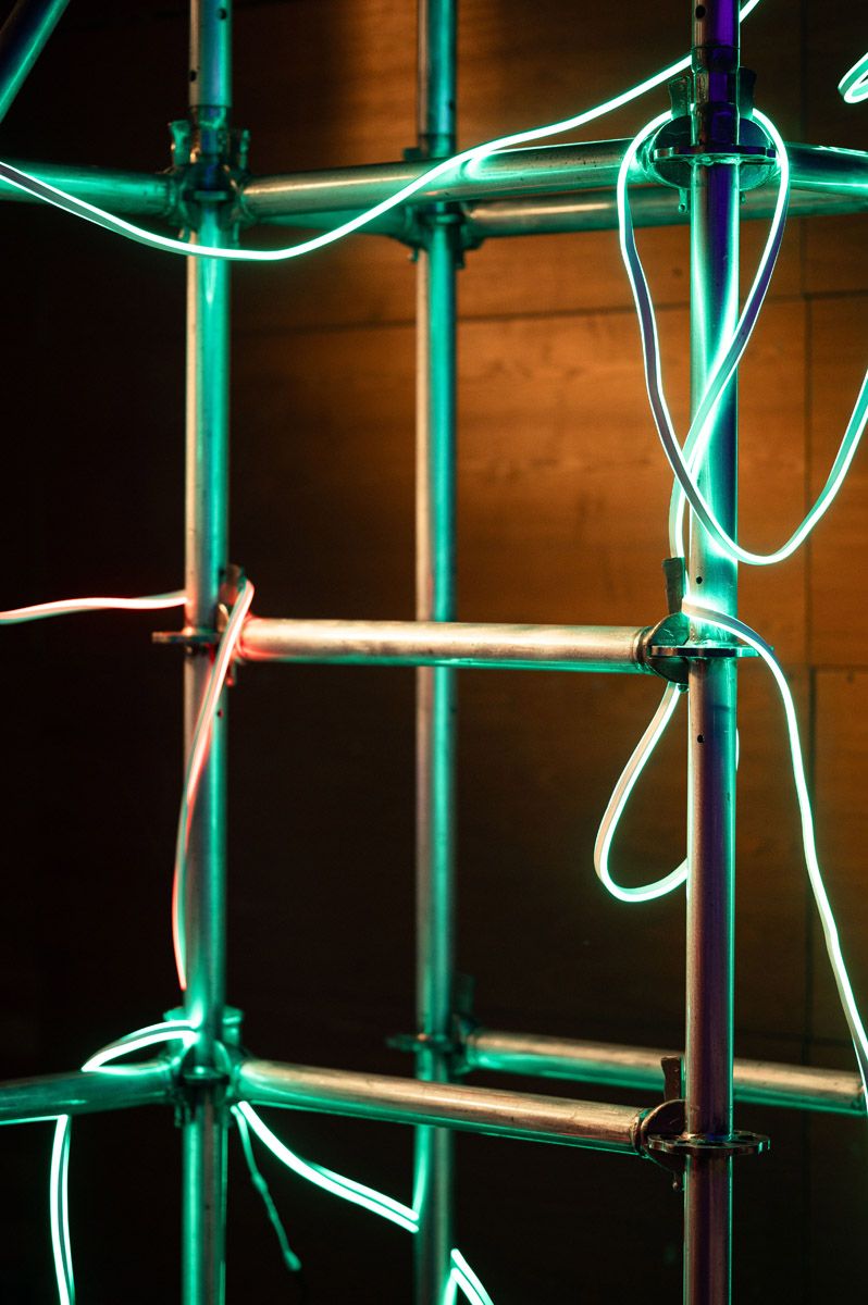 Futuristic neon installation at the Evoverse 2077 corporate event