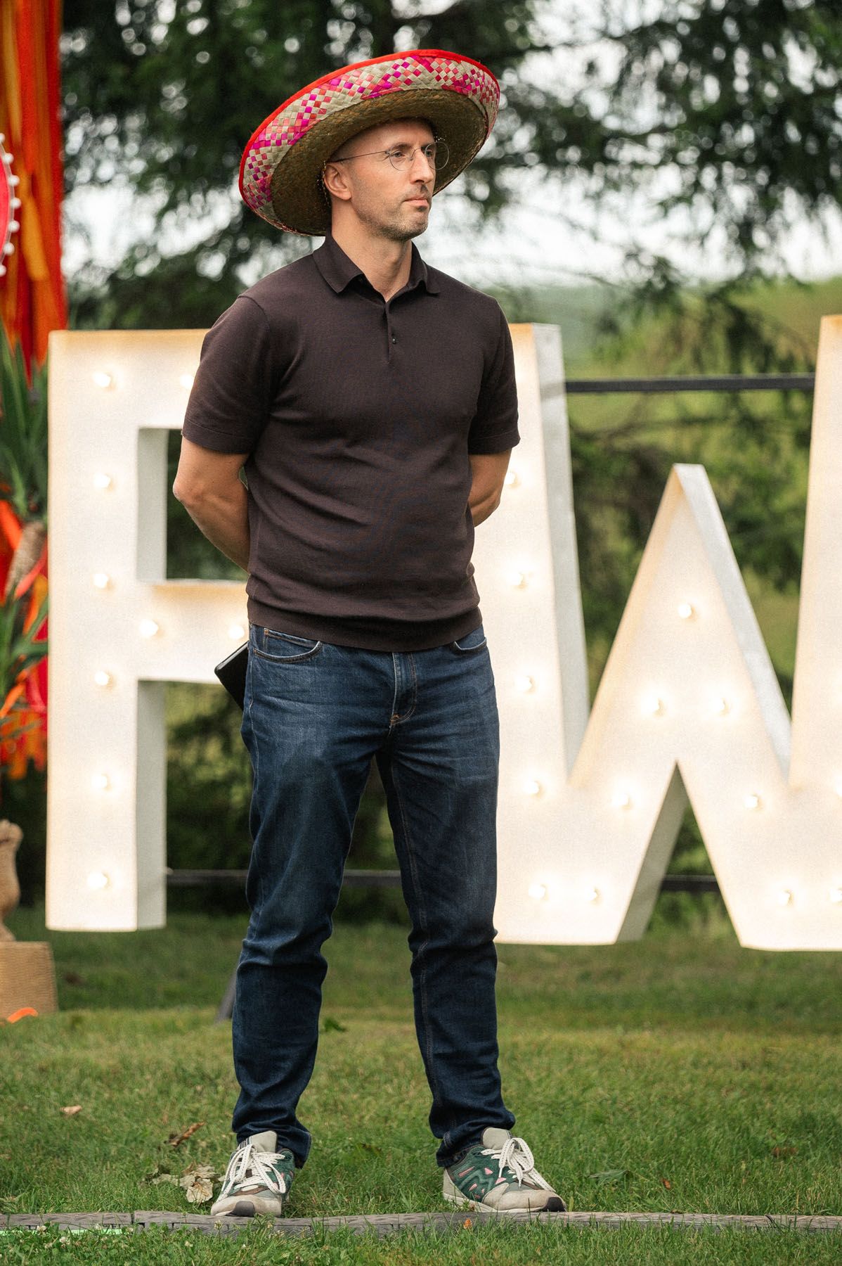 Guest standing beside the PWC event sign