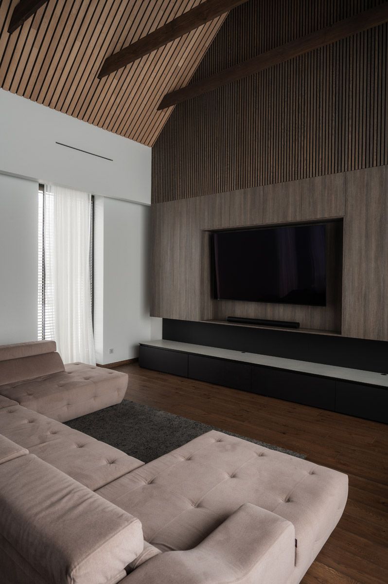 Living room with fireplace and custom wood wall