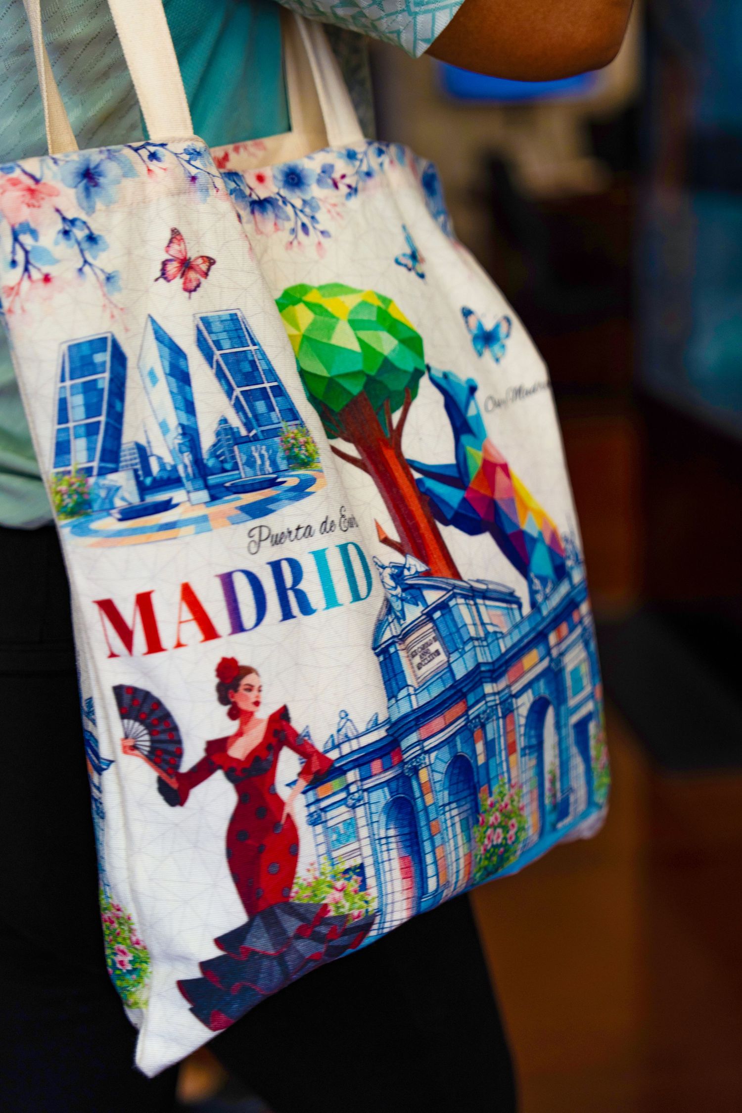 Colorful Madrid souvenir tote bag featuring landmarks and a flamenco dancer.