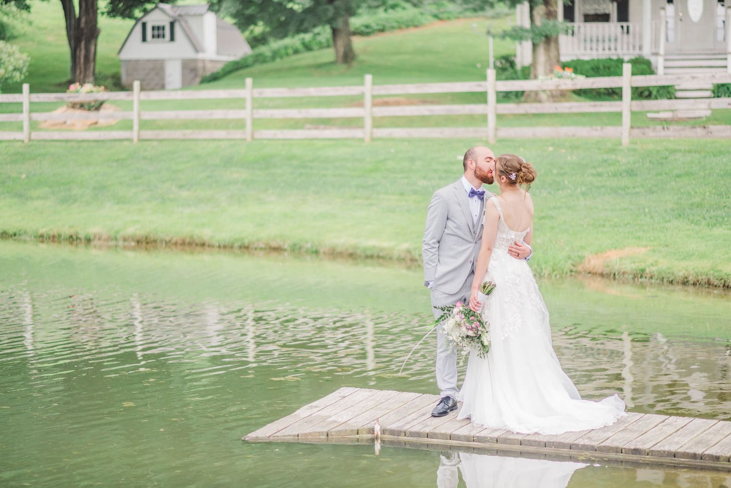 Bride and groom next to lake at Joiner Farms in Northern Cambria, Pennsylvania
