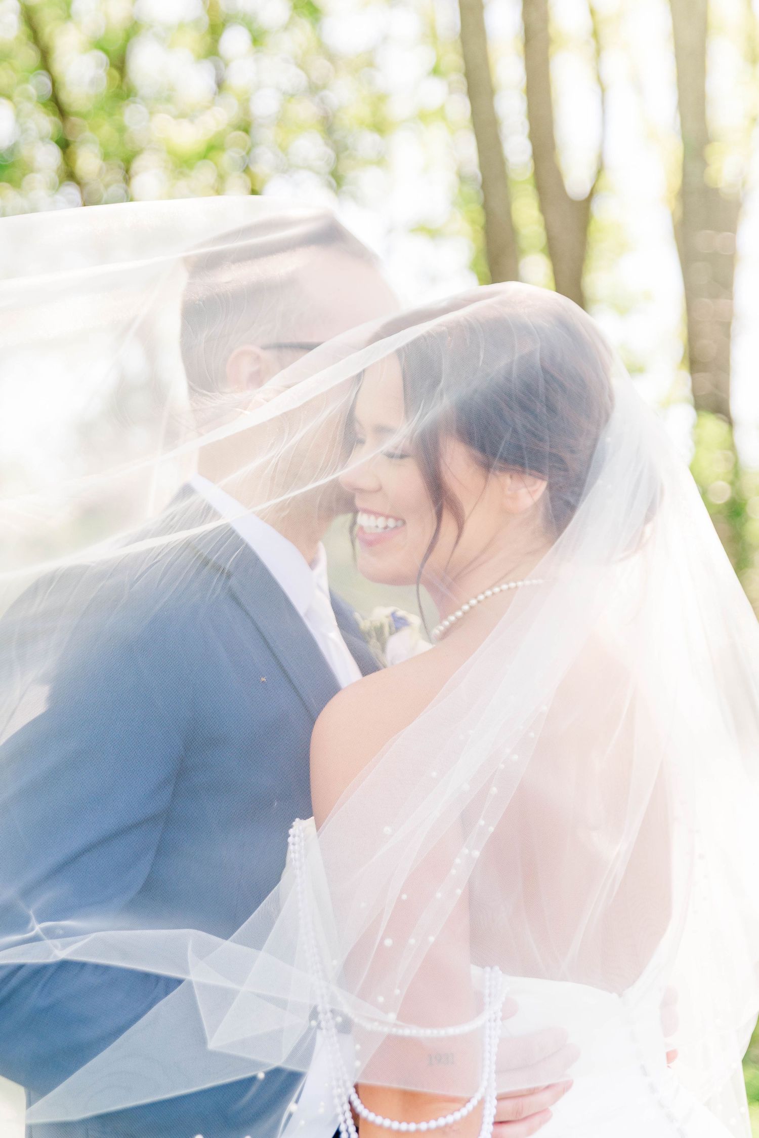 Bride and groom under veil at the Willow in Johnstown, Pennsylvania