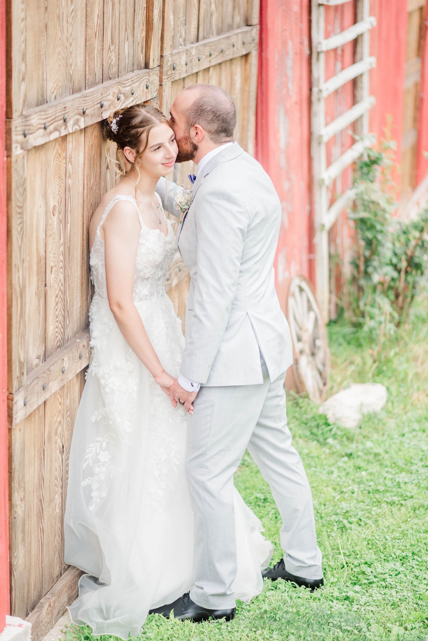Bride and groom beside the barn at Joiner Farms in Northern Cambria, Pennsylvania