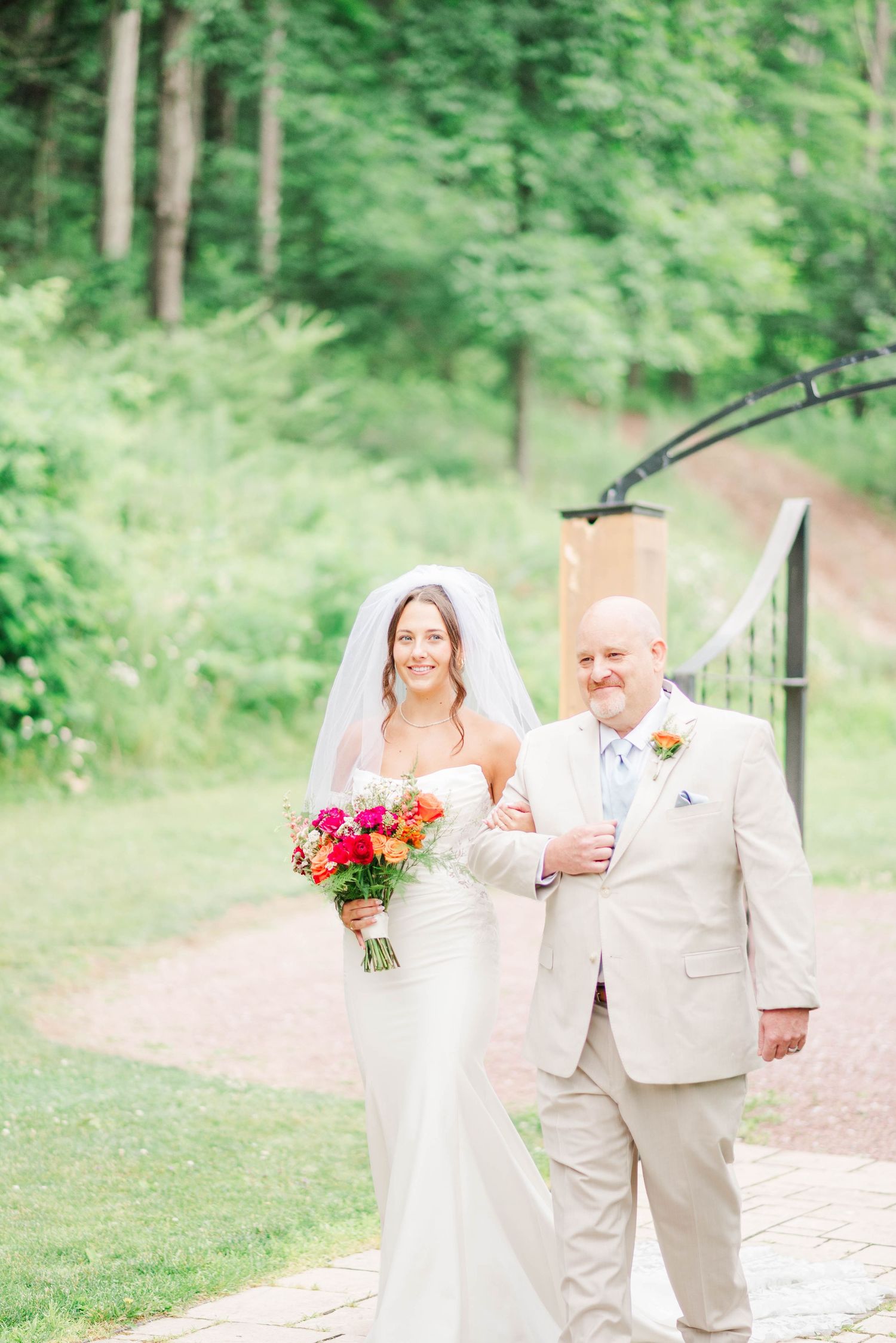 Walking with the aisle with dad at Whispering Hollow Estates in Pleasantville, Pennsylvania