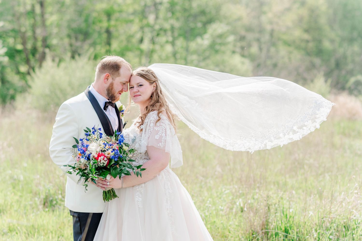 Bride and groom with veil at the Roost in Mahaffey, Pennsylvania