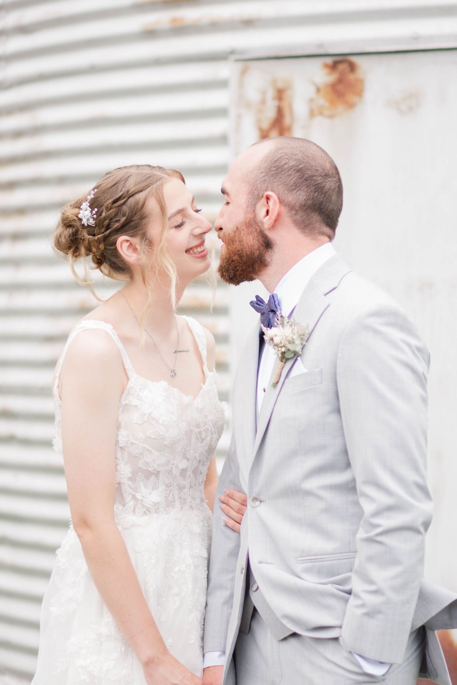 Bride and groom in front of silo at Joiner Farms in Northern Cambria, Pennsylvania