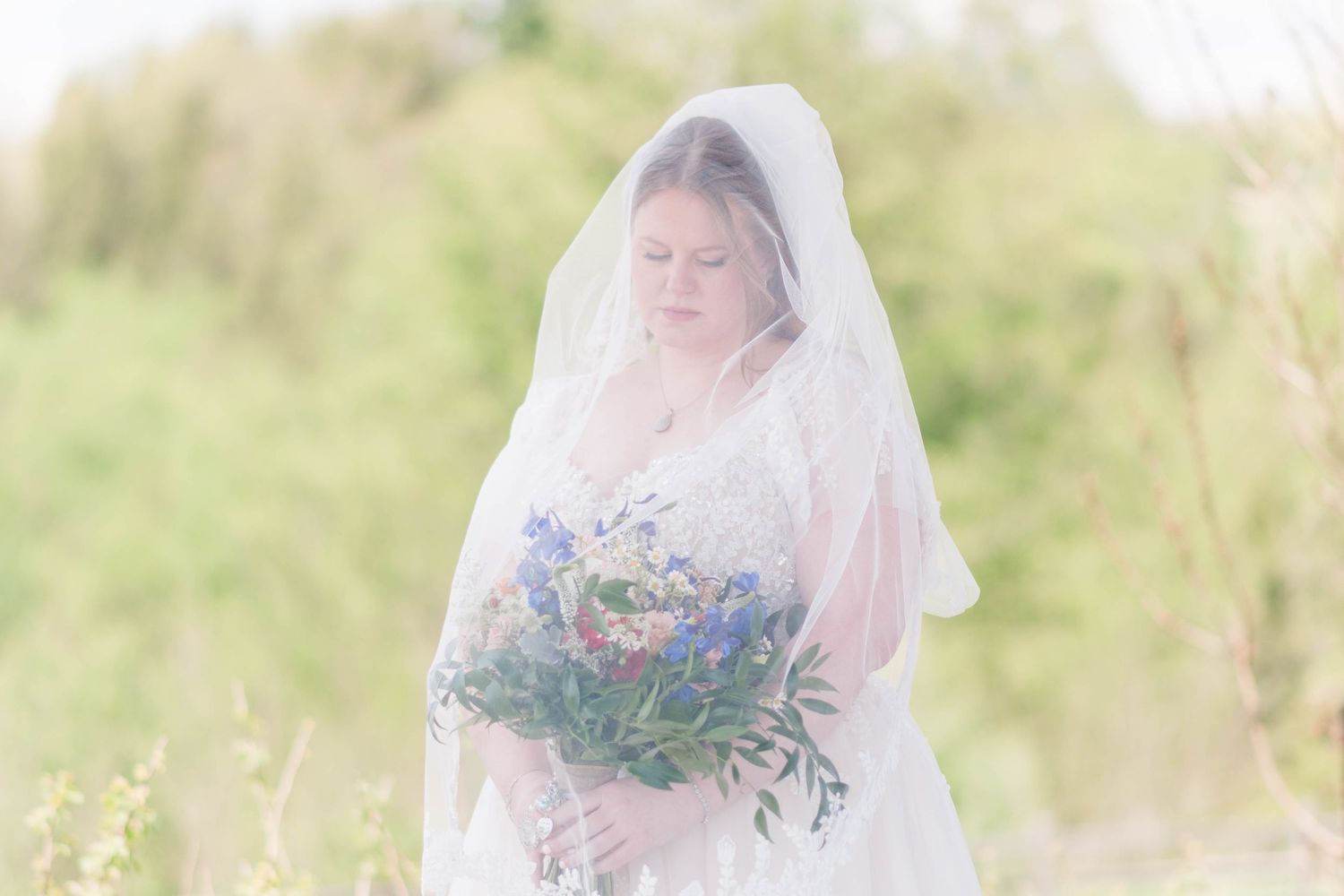 Bride under her veil with bouquet at the Roost in Mahaffey, Pennsylvania